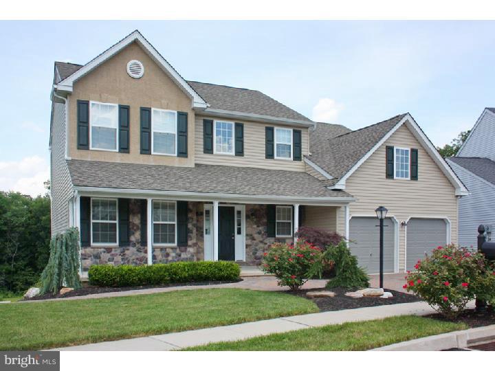 What a beautiful Home on a great lot, absolutely MINT CONDITION!!! This Home has an excellent outside view from your 2nd story deck. You are looking at trees and shrubs, not neighbors. This 4 Bedroom, 2.5 Bath, stone front colonial with a full covered front porch. has been lightly used and meticulously kept. Very appealing landscaping with extra wide paver driveway for parking and convenience. There is also a paver walkway and rear patio. Open Concept Floor plan, lovely Sun Room off the kitchen brings in the natural light. Inside has dark cherry stained Bruce 3/4 hardwood flooring in the foyer and hall areas. Granite kitchen counter tops with dark cherry stained, 42 in cabinets. Kitchen Island and generous size kitchen pantry. Formal Dining Room and Living room boast neutral wall to wall carpeting, as do the spacious four bedrooms. Relax in the spacious family room with Marble fireplace. On the 2nd floor A large soaking tub and shower stall tub accommodate the master bedroom, which has good size "his & her" walk in closets. Very convenient 2nd floor laundry. The walk out basement is recently finished and the owner will add your selection of carpet and paint colors.