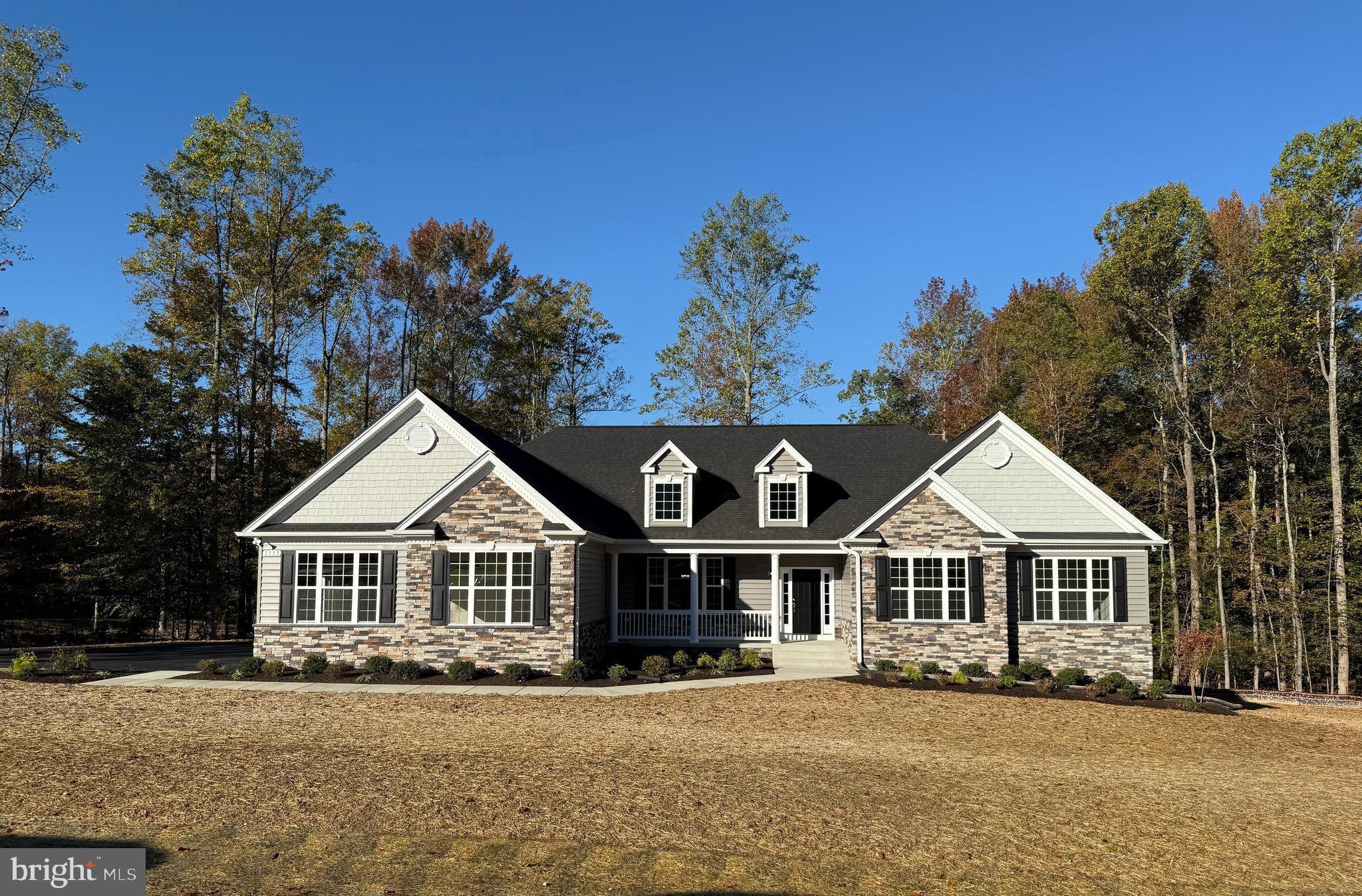 QBHI's gorgeous stone front Winchester with added gables is a favorite! This home features a 3 car side load garage, mudroom, cathedral ceiling in owners bedroom with full bathroom, including the deluxe shower, separate vanities and soak in tub. Added rear extension for larger rooms, closets and pantry. Gas fireplace, upgraded kitchen with Island and breakfast bar with kitchen table space and a formal dining room. The basement is unfinished for future plans and storage.