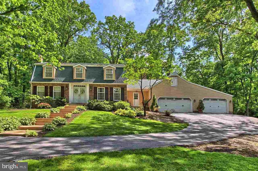 Beautiful setting in Rocky Ridge on private cul de sac & 1 ac park like setting.  Enter double doors & immediately enjoy all the home has to offer.  Nearly 4000 sq ft  w/4-5 BR & 3.5 BA.  Bonus sunroom to enjoy outside even during those rainy days!  EIK w/granite, SS appls & open to sunken living rm.  Fin LL rec rm too!  Central schools & prime location!