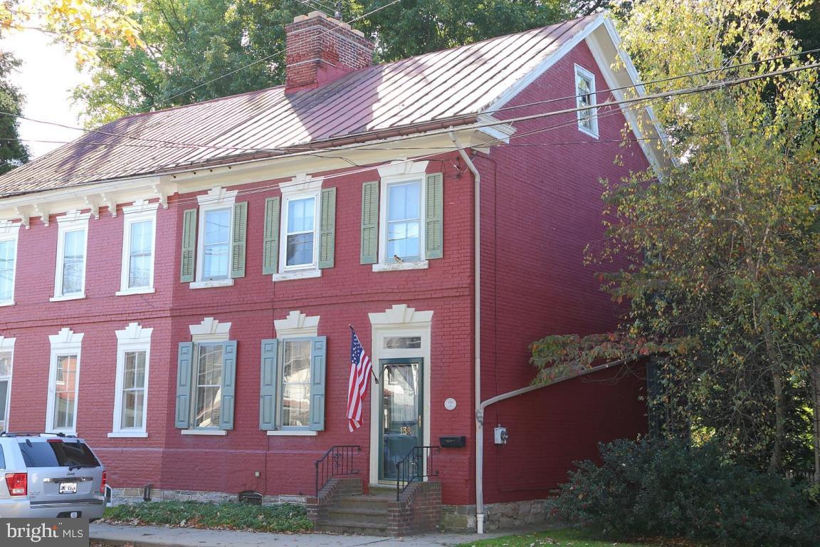 Historic brick semi. available on Main Street Strasburg/ 1795 circa/ Original front & rear stairway including handrail/ Original wood burning fireplace in living room/ Cozy side porch for evening relaxing/ Secluded rear yard/ Off street parking with small garage.