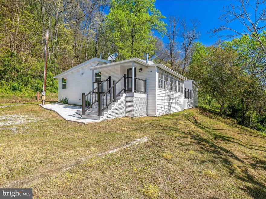 Home is within walking distance to downtown Berkeley Springs and also near the Berkeley Springs High School.  Home is spacious with 5 BR and 2 BA.  There is an original mobile home under all of the renovations. Most recent renovations in 2021. City Water and City Sewer.  Plenty of room with this one!