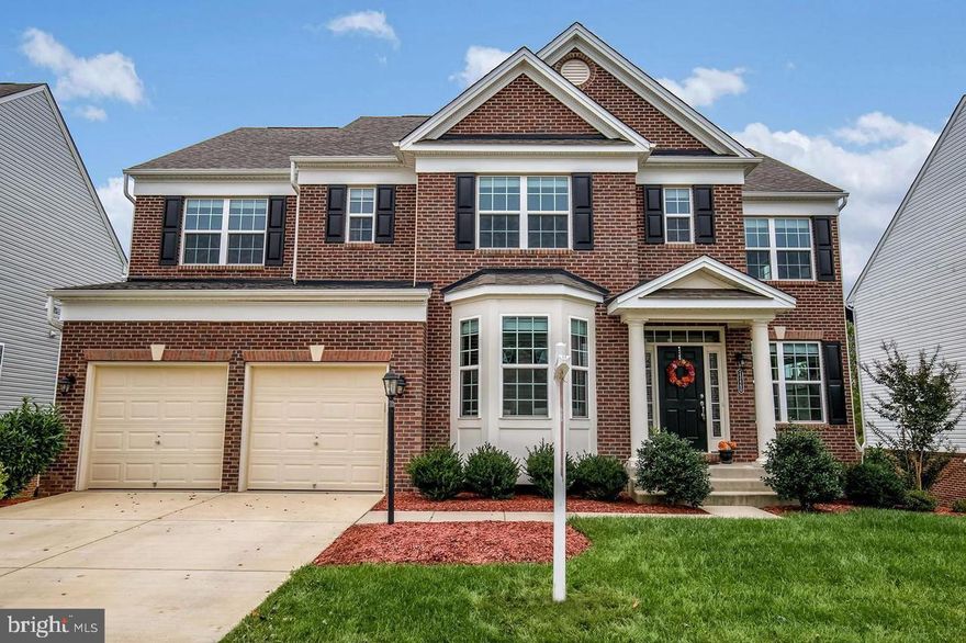 Gorgeous brick front colonial! Rare wooded home site backing to trees. Main level features HW floors, crown molding in dining room, a vast family room w/ fireplace, eat-in kitchen complete w/ glimmering granite counters & 2 wall ovens. UL has 4 BRs  and MBR w/ sitting room & master BA w/ dual vanities, soaking tub & large shower. Finished basement w/ full BR & full BA, + walkout access to backyard