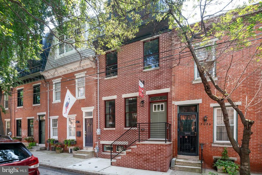 100% complete, beautifully staged, and ready for showings!  Incredible new construction opportunity on one of Graduate Hospital’s premier tree-lined blocks. This custom-built home with tax abatement by one of the city’s most experienced builders is located in the coveted Greenfield catchment and is a short walk to Rittenhouse Square, Schuylkill River Park and UPenn, CHOP & Drexel in University City.  All your boxes are checked at 2024 Kater St. with 4 beds, 3 full baths, a finished basement, chef’s kitchen, large patio, full primary suite with wet bar and roof deck with amazing skyline views. Proceed past the timeless new brick façade with 3rd floor mansard roof and enter the wide-open main level with hardwood floors, high ceilings, surround sound speakers and custom ceiling soffit with LED lighting. The rear kitchen offers quartz counters with a large island, stainless appliances, under cabinet lighting, wine fridge & a pantry. Sliding doors lead to your large private patio ideal for a BBQ or outdoor dinner with family/friends. Ascend the floating staircase to the 2nd level with large front and rear bedrooms, a hall bath with stall shower and a convenient laundry closet with stackable washer and dryer. Ascend the floating stairs again to the 3rd floor primary suite with wonderful skyline views, a huge walk-in closet with custom shelving & a 4-piece bath with double vanity, custom stall shower with frameless glass surround & soaking tub. There’s also a wet bar before you exit to the fantastic roof deck complete with unobstructed 360-degree views of the city. The finished basement has high ceilings, a front entertainment room, another full bath, and a large private rear room to use as a 4th bedroom. Simply a tremendous opportunity on one of Grad Hospital’s most picturesque blocks built by an experienced, respected developer. Approved tax abatement, 2-year warranty, roof deck, finished basement, custom finishes, built-in speakers, dual zone HVAC, Greenfield Elementary catchment, and an A+ location. Walk to Rittenhouse Square or the South St. bridge to UPenn and CHOP plus easy access to Amtrak, 76 and the airport. City living at its finest in a perfect home that will exceed all your expectations!  Will not last, schedule your showing today!
