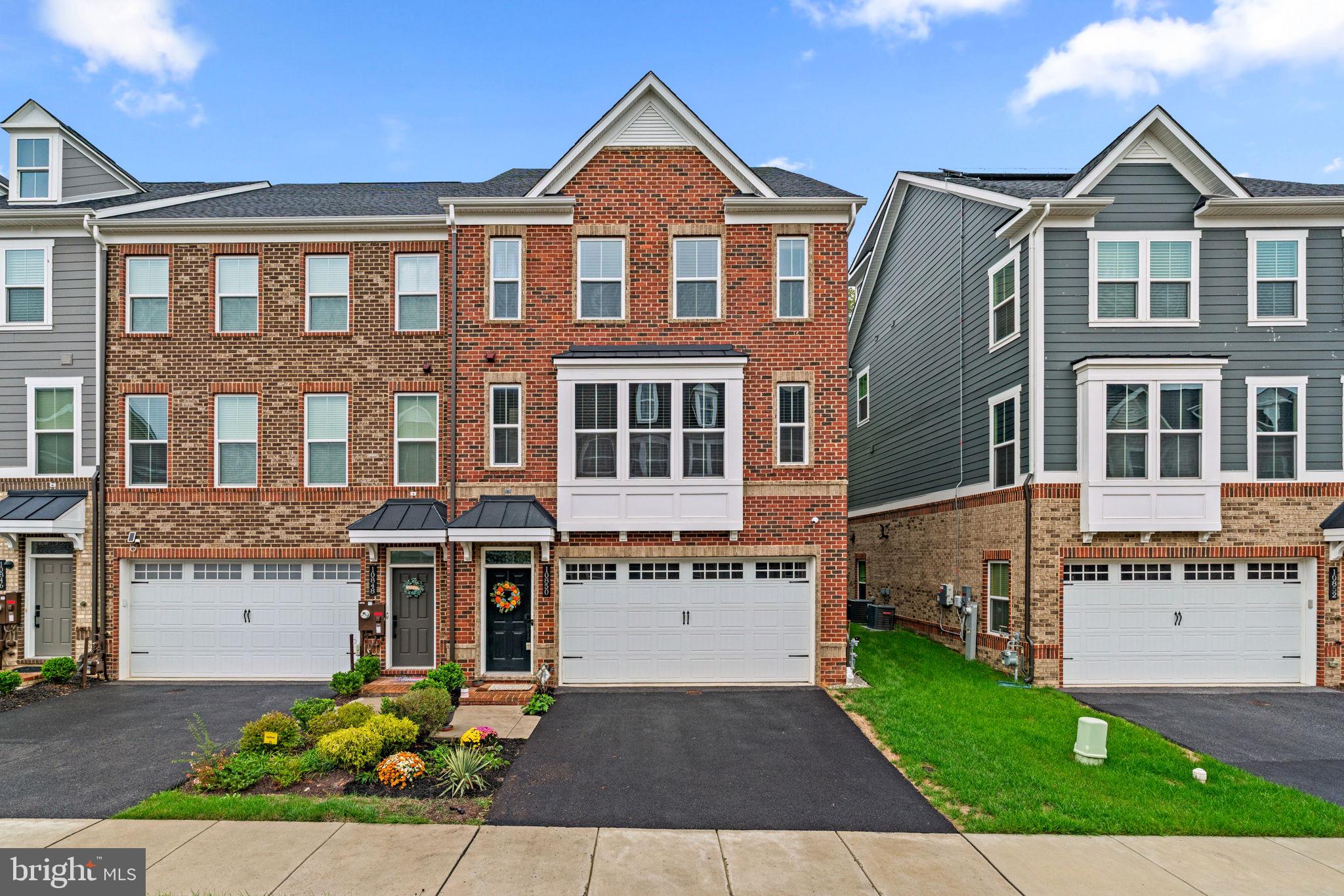 Stunning end-of-group townhouse offering 2,804 square feet, 4 bedrooms, 3 full baths, 1 half bath, and a 2-car garage in Greenleigh at Crossroads. Step inside the beautifully updated interior, beginning on the entry-level foyer with a built-in bench seat and lower storage. Find a fully finished recreation room with rear access, a private bedroom with a large closet, and a dual-access full bath, ideal as a guest suite. Upstairs, the bright and open main level showcases stylish LVT flooring throughout. The sunlit living room, complete with a convenient powder room, flows seamlessly into the upgraded eat-in kitchen. The kitchen offers quartzite counters, a classic subway tile backsplash, a pantry, and stainless steel appliances, including a double oven and smart-enabled dishwasher. An oversized island with breakfast bar seating and pendant lighting anchors the space, while a breakfast area with a coffee bar opens to the balcony overlooking the tree-lined backyard. The upper level hosts three spacious, carpeted bedrooms and two full baths. The primary suite includes a ceiling fan, a bath with a dual-sink vanity, and an upgraded frameless shower. The two additional bedrooms include rough-ins, making it easy to add ceiling fans. This level also features a convenient laundry room with custom shelving installed. Modern updates throughout the home include a UV light air filter, whole-house humidifier, sump pump battery backup, smart-enabled front washer and dryer, smart-enabled garage, Nest® thermostat, Ethernet ports in every room, video doorbell, and a security system that detects carbon monoxide, smoke, and water leaks. The 2-car garage is outfitted with sealed flooring, built-in storage shelves, laundry shelves, and an EV port. Community amenities include a clubhouse with a fitness center and yoga studio, a pool, multiple tot lots, a secured dog park, and scenic trails. The location offers convenient access to a MARC Station, major highways, and Baltimore City.