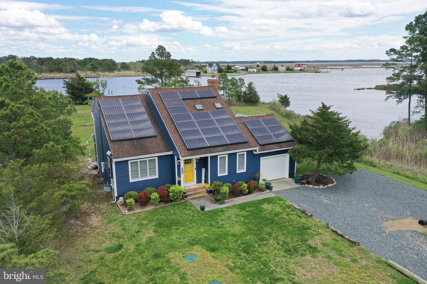 WATERFRONT Retreat - Your Eastern Shore getaway - boat, fish, crab from your private pier on St Peters Creek leading out to the Manokin River and Chesapeake Bay - featuring an incredible home - waterviews from most every room, balconies, screened porch, deck, and gazebo. Big-ticket updates galore in the last 2 years - new siding and insulation, encapsulated crawlspace, septic and drainfield, extended porch, new garage door and opener, LVP flooring, new HWH, and reverse osmosis filter, and so much more - full details attached to listing. Interested in short-term vacation rental income? This home has been successfully rented - earning $20,000 for only April-December 2022. Convenience of 1st floor bedroom and full bath. Formal dining room w/vaulted ceiling. Dreamy kitchen updated a few years ago - gorgeous cabinetry, granite counters, flooring - opens into the bright and spacious living room w/fireplace and sliders to the waterfront, screened porch.  2nd floor primary bedroom offers a full, en-suite bath and private balcony with sweeping views of the River and natural shoreline. Soak in the sun or enjoy a morning coffee listening to the water, watching the ospreys and herons. 2 additional bedrooms and a 2nd full bath complete the 2nd floor. Screened porch was extended and offers room for plenty of friends to gather and dine, chat about unique treasures they found shopping - or head out to the firepit and share the day's fish tales. The gazebo is a great place for relaxing with a book. Huge front and back yards in this remote oasis - yet just 10mi to Historic Downtown Princess Anne, offering boutique shops and restaurants. Transferable MDE permit for floating dock extension. Save tons of money on utilities thanks to the solar panels and updated insulation! Sizes, taxes approximate