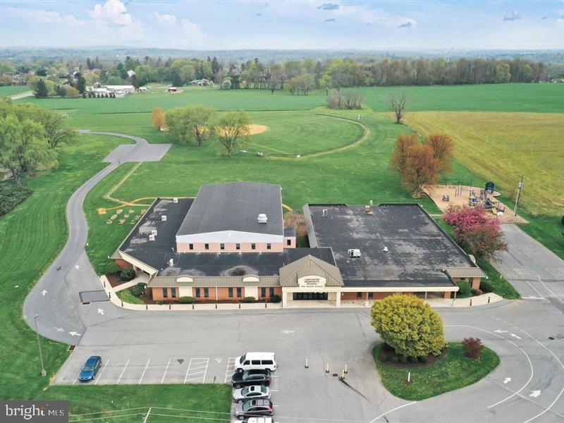 Well maintained former private school building of +/- 28,295 SF located midway between Millersville and Willow Street in Pequea Township, zoned Commercial. Lancaster Mennonite plans to remain in occupancy through 2021-2022 school year with buyer possession to follow. Short term lease back is a possibility. Split-system air conditioning in most classrooms, private powder room in most classrooms, ADA accessible, new propane tank recently installed, structure and roof in excellent condition.