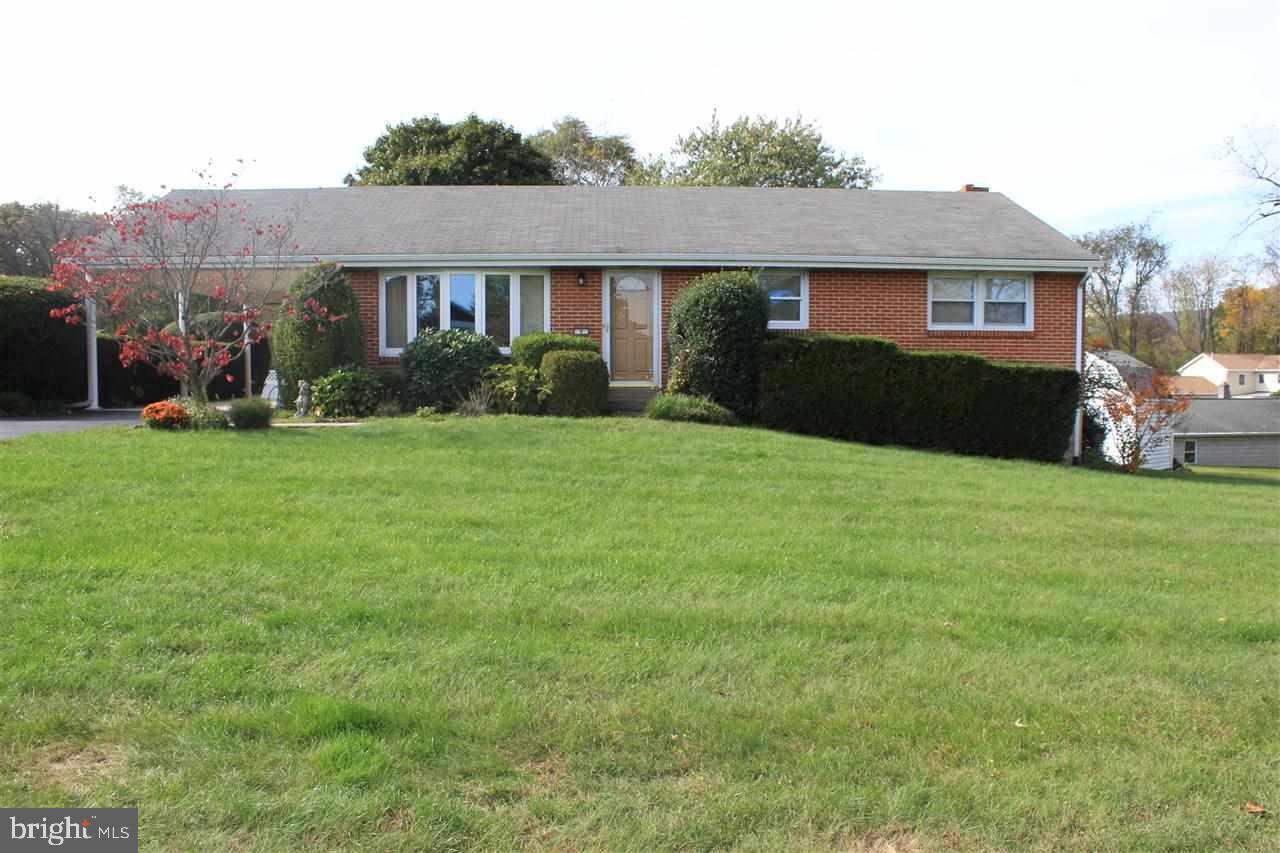 All brick ranch home in the Sherwood Park neighborhood in Enola. Beautiful hard wood floors throughout. Large eat-in country kitchen with laminate floor. Ceramic tile bath's. Finished basement includes pool table with large windows to let in lots of natural light and a wood burning fireplace! 1 year home warranty included.