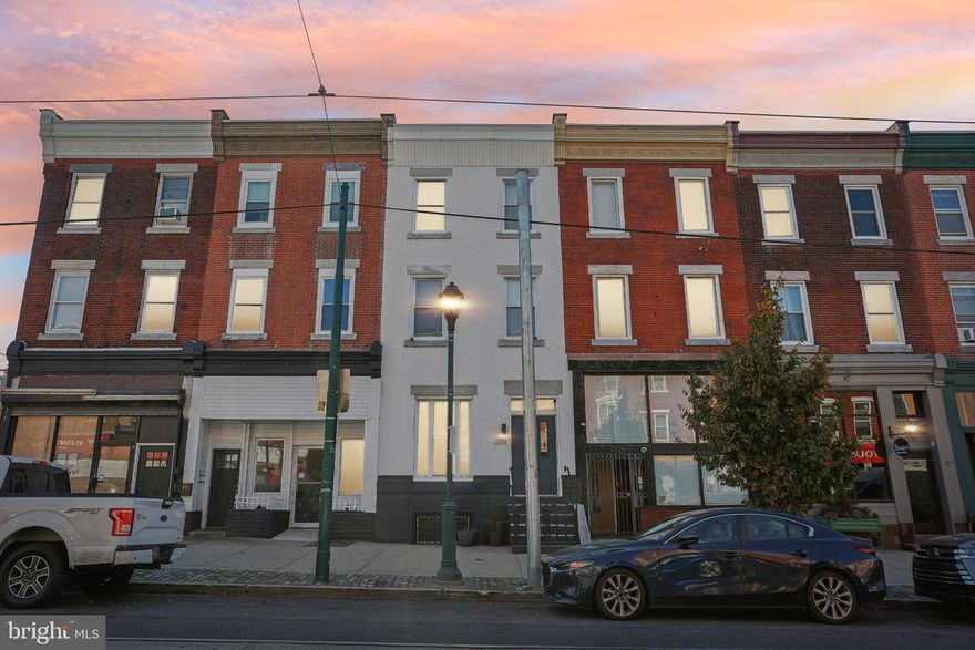 Welcome to this extraordinary 5-bedroom, 2-bathroom townhome, perfectly positioned on Girard Avenue, between the vibrant neighborhoods of Fairmount and Brewerytown.

From the curb, the elegance of marble steps and custom wrought-iron railings immediately draws your attention, setting the tone for the craftsmanship that awaits inside. Historic details, paired with modern updates, give this home a timeless charm.

Step into a spacious, open-concept living and dining area framed by impressive columns, where soaring ceilings and recessed lighting fill the space with natural light. The layout flows seamlessly to the chef’s galley kitchen, a culinary haven equipped with stainless steel cabinetry, sleek quartz countertops, and a striking glass tile backsplash. The adjacent enclosed yard is the perfect spot for al fresco dining, container gardening, or summer grilling.

On the second floor, you’ll find two generously sized bedrooms—one at the front, the other at the rear—along with a versatile middle room that could function as a bedroom, office, or cozy den. The fully updated bathroom on this level features a chic glass-enclosed shower, contemporary tiling, and a convenient stacked laundry area.

The third floor offers even more possibilities, with two additional bedrooms. One of these is a large double room ideal for a home office, studio, or creative retreat. A second full bath completes this level.

The full basement offers abundant storage and endless potential, whether you're seeking a woodworking space, hobby area, or home gym. Throughout the home, a sophisticated mix of vintage and modern flooring adds texture and warmth, enhancing the overall character.

With CMX2.5 zoning, the potential for this home extends beyond its current use, offering a variety of possibilities for the future.

Enjoy easy access to major highways, public transportation, Fairmount Park, Boathouse Row, museums, and a host of beloved local destinations. Don’t miss this rare opportunity to own a truly unique and versatile townhome.