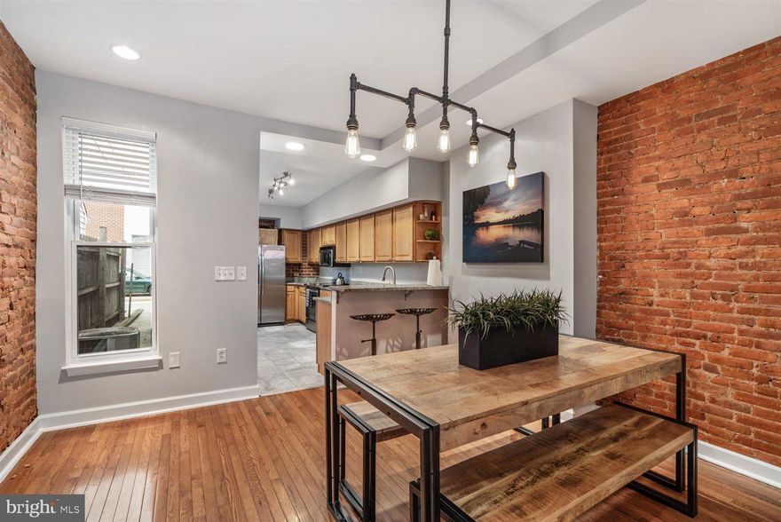 Beautiful 2 Bedroom, 2.5 Bathroom Townhome Located In Federal Hill. Walk In and Be Greeted By A Lovely Living Room With Tons Of Natural Lighting& Gorgeous Exposed Brick,  Dining Room With A Beautiful Hanging Chandelier, A Kitchen With Breakfast Bar, Granite Countertops, & Stainless Steel Appliances. The Main Level Is Complete With A Half Bathroom, And Back Entrance To The 1 Car Parking Pad. The Upper Level Includes 2 Spacious Bedrooms With Two Full Bathrooms, Recessed Lighting, Exposed Brick And Laundry Room! The Lower Level Offers A Unfinished Basement That Has Additional Storage.