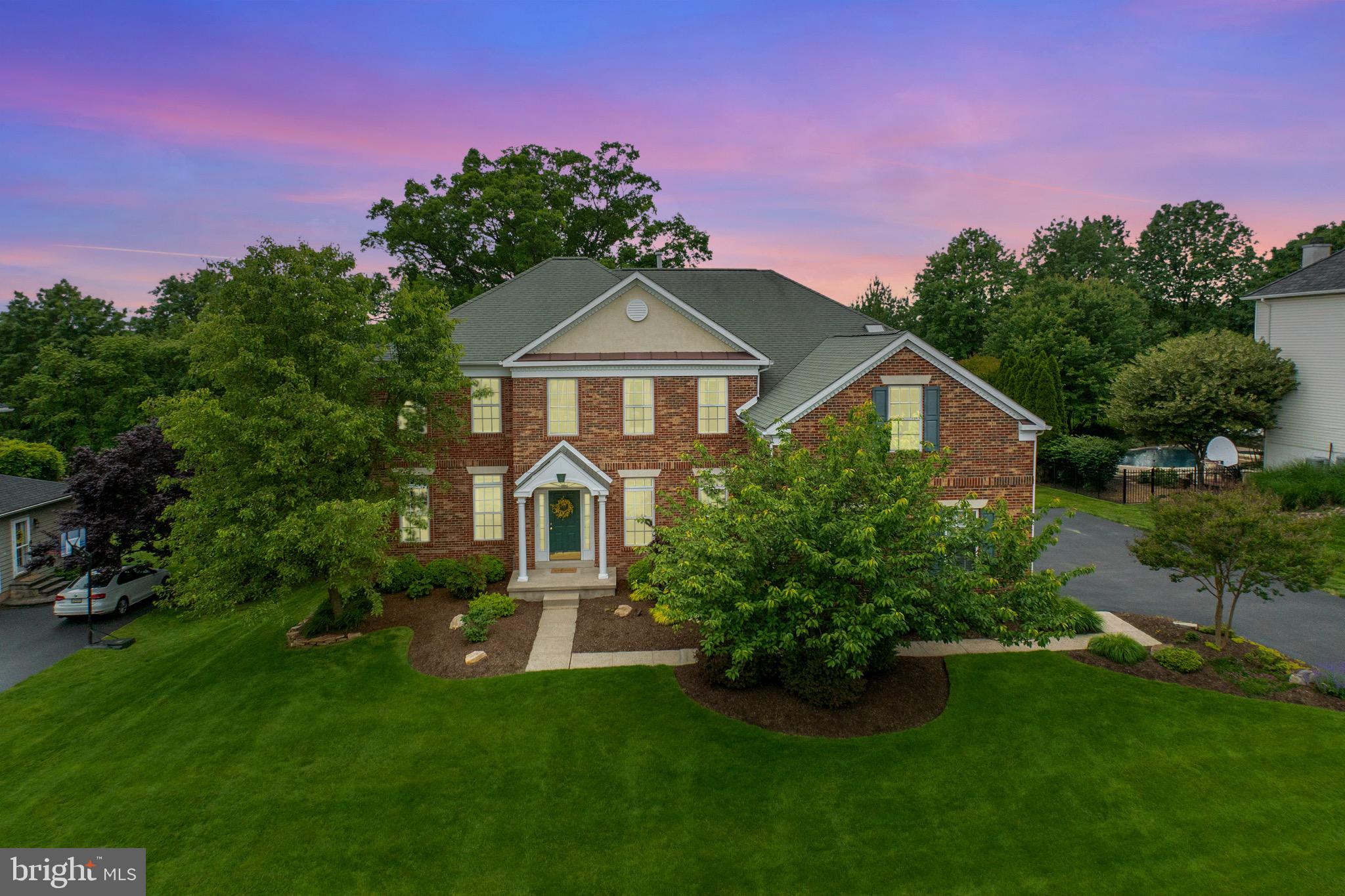 Welcome home to the Estates at Providence Reserve in Upper Providence Township and the award winning Spring Ford School District! This meticulously kept 4 bedroom, 3 full bath and 2 half bath brick front colonial boasts approx 4450+/-sqft on three levels. The home is nestled on a desirable cul-de-sac & on a well-manicured .39+/-acres with meandering landscaping beds. ** This conveniently located home is just minutes to Providence Town Center offering Wegman's Market, Movie Tavern theater, shopping, restaurants & hotels in addition to a few minute drive to downtown Collegeville, Phoenixville, Valley Forge & King of Prussia, which all offer an array of quaint shops, restaurants, parks & trails & easy access to major highways. All this, and just a simple 2 minute walk to Anderson Farm Park & Community Center where recreational activities, sports, classes, & summer concerts abound! ** Step inside to discover the bright & open floor plan, which is thoughtfully designed to cater to all of your family's needs. The center hall, two story entrance foyer is enhanced w/refinished hardwood floors and flows into the sun-drenched living room accented with crown molding and recessed lighting. The living room offers glass french door entry to a generous sized office/flex/bonus room with lovely views of the rear yard. The formal dining room, accented with columns, offers ample space for larger gatherings & features crown molding, chair-rail and a butler's pantry with wet bar. The glorious, sun filled, two story family room is enhanced with stunning floor to ceiling windows, a cozy gas fireplace, ceiling fan, and a second glass french door entry to the office/flex/bonus room. ** The family room adjoins the spacious eat in kitchen which offers an abundance of cabinet space, quartz counters, a spacious island, coffee bar, refinished hardwood floors & pantry. The kitchen eating area provides sliders that flow into the highlight of the home, the incredible screened in porch! This amazing outdoor living space is accentuated with a cathedral ceiling w/wood beams and ceiling fan. You will surely enjoy endless hours relaxing, unwinding, reading or just enjoying the tranquility this fabulous outdoor living space has to offer! The screened in porch leads to the side yard and extends to an expansive deck, which is perfect for alfresco dining & entertainment and offers access to the level rear yard which is ideal for large gatherings, outdoor games & festivities! Completing the first floor are a laundry room with utility tub, powder room, ample closet space, a 3-car garage with storage shelves & side entry door. ** As you ascend to the second floor you will be captivated by the custom balcony overlooking the family room! Transcend the hallway to the private & luxurious primary bedroom suite which is highlighted with a tray ceiling, a sitting room (with column accents) that overlooks the rear yard, a sumptuous bathroom w/double vanities, a generous sized walk-in shower, soaking tub & private commode area, a make-up area, two walk-in closets & a linen closet. Finishing the primary suite is a bonus room offering a variety of potential uses such as an office, workout area, tv room or nursery! Completing the upper level are three additional, generous sized bedrooms. Bedroom two offers an ensuite bath, ceiling fan and closet. Bedrooms three and four have ceiling fans, large closets & share a hall bath. All bedrooms are light-filled & generous in size and closet space! ** The lower level offers an abundance of family fun space! Featuring a great room with walk-in closet, perfect for games & toys, a game room & dry bar area w/mini-fridge, to watch your favorite sports. Sliding glass doors lead to your outdoor space which is ideal for gatherings, parties & entertaining! ** This home offers new carpet on the 1st & 2nd floor, fresh paint in many rooms & newer utilities. ** Check out 3-D virtual tour or the highlight video ** Offer deadline Sun 6/8 7pm **