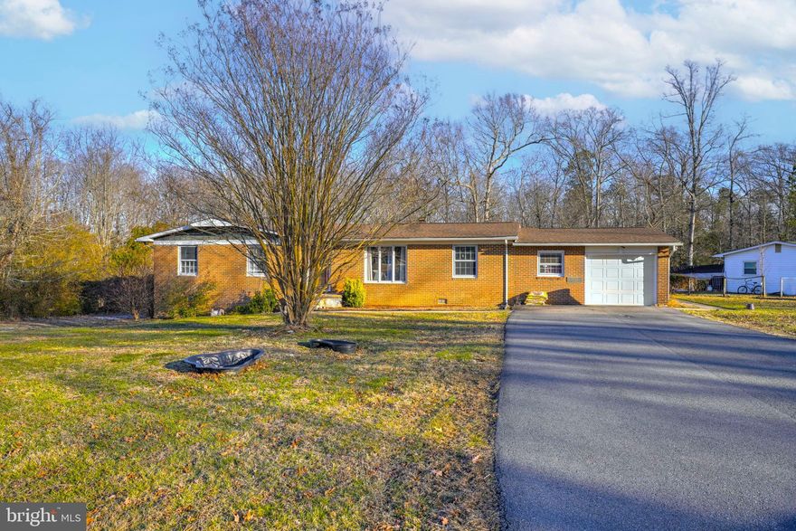 Nestled in the charming Barefoot Acres neighborhood, this delightful ranch-style home offers a perfect blend of comfort, convenience, and location. Built in 1969, the classic brick exterior delivers timeless appeal, while the spacious interior features three cozy bedrooms and three full bathrooms—ideal for both everyday living and hosting guests.

The heart of the home includes essential appliances such as a refrigerator, washer, and electric dryer, making daily routines simple and efficient. Cozy evenings by the fireplace set the stage for relaxing after a long day, and the attached garage provides easy access and secure parking.

Situated on a generous 0.46-acre lot, there’s plenty of room to unwind outdoors, garden, or enjoy play space. Just a short commute to NAS Patuxent River (PAX), this home is especially well-suited for military members, civilian contractors, and anyone seeking proximity to the base while still enjoying a peaceful residential setting.

With nearby parks, shopping, and dining, this location offers both convenience and community—an inviting place to call home whether you’re relocating, PCS’ing, or settling in for the long term.