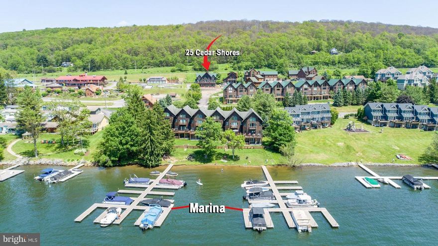 OPEN HOUSE DATES:
SUNDAY, JUNE 28, 2026 FROM 12:00 - 1:00 PM
MONDAY, JULY 6, 2026 FROM 12:00 - 1:00 PM
List Price is Opening Bid at Online Auction to be conducted on auctioneer's website. Bidding begins Friday, July, 3rd @ 1:00 PM and ends Wednesday, July 8, 2026 at 1:00 PM.
Experience the perfect blend of rustic elegance and modern comfort at The Lodge at McHenry Cove, a stunning mountain retreat overlooking Deep Creek Lake and the ski slopes of Wisp Resort. Nestled within the highly desirable Cedar Shores community, this exceptional five-bedroom lake-area home offers upscale finishes, spacious accommodations, and an unbeatable location just moments from the region’s premier attractions and outdoor recreation.

Thoughtfully designed for year-round enjoyment, the residence showcases soaring cathedral ceilings, expansive windows with scenic lake views, and warm cabin-inspired décor that creates a true mountain-lodge atmosphere. The gourmet kitchen is appointed with stainless steel appliances, generous prep space, and an open layout ideal for entertaining. The adjoining living and dining areas provide inviting gathering spaces for relaxing with family and friends after a day on the lake or slopes.

The main-level primary suite offers a private retreat complete with a king bedroom, spa-inspired bath featuring a soaking tub and separate shower, while an additional guest suite includes a queen bed and attached full bath. Upstairs, the loft and game area provide additional living space with a queen sleeper sofa, alongside a private king suite with luxurious en-suite bath and two additional bunk-style bedrooms perfect for hosting larger groups.

Outdoor amenities are equally impressive, featuring a private hot tub, gas grill, ample parking, and peaceful surroundings that capture the essence of mountain living. Residents and guests enjoy convenient walkable access to the community lake area and dock slip, as well as nearby restaurants, shopping, mini golf, and entertainment. Golf courses, state parks, hiking trails, and four-season recreation are all just a short drive away.

In addition to the residential amenities, the property also offers exceptional waterfront and storage features including a 32-slip commercial marina, five 10’ x 20’ storage garages, four 10’ x 30’ storage garages, 12 kayak rental racks, and two moorings for offshore docking—creating outstanding potential for recreational use and income-generating opportunities.

Whether you are searching for a full-time mountain residence, vacation getaway, or investment opportunity, The Lodge at McHenry Cove delivers the ultimate Deep Creek Lake lifestyle in every season.

Property Features

• 5 Bedrooms | 4.5 Bathrooms Approx. 5,482 sq. ft. 
• Gourmet kitchen with stainless steel appliances
• Vaulted ceilings and expansive lake-view windows
• Open-concept living and dining areas
• Loft and game area with pool table
• Fireplace
• Central A/C
• Outdoor hot tub
• Laundry area
• Adequate Parking for the Marina Slips and House

Waterfront & Marina Features

• 32-slip commercial marina
• 5 storage garages measuring 10’ x 20’
• 4 storage garages measuring 10’ x 30’
• 12 kayak rental racks
• 2 permitted offshore moorings
• 21 +/- Parking Spaces

Community & Lake Access
Located within the Cedar Shores community, the property includes convenient lake access directly across the road behind the final row of Cedar Shores Villa townhomes, along with access to the community dock slip at Deep Creek Lake.