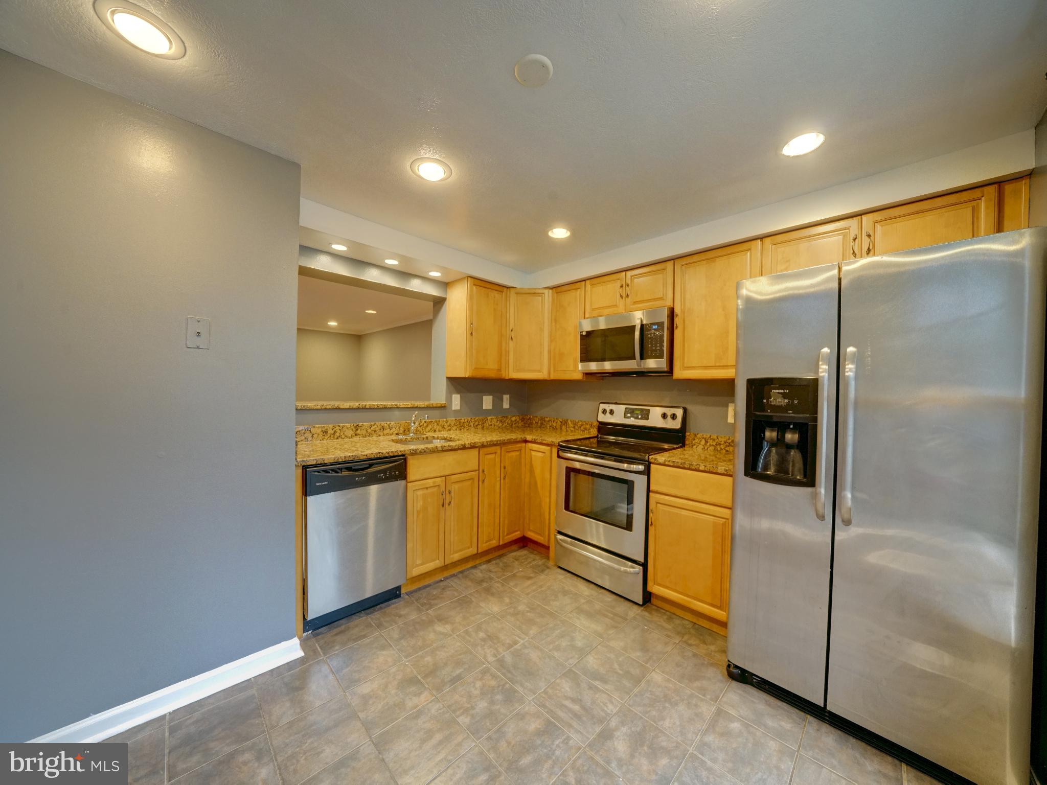 Available now - This nice 3 bedroom, 2 full bath, and 1 half bath townhome in Howard County Laurel is for rent. Freshly updated neutral paint, new hard surface flooring in all bedrooms, new carpet on steps, many new interior doors, new microwave, some recessed lighting Sept 2025. Major upgrades were done a few years ago to kitchen and baths. The main level has easy clean hard surface flooring in the eat-in kitchen, half bath, and large living/dining room. There is a slider to a spacious deck allowing plenty of natural light. The upper level offers 3 bedrooms with new LVP flooring, ceiling fans, new doors and 1 Full Bath. A large tiled basement has 2nd full bath, storage room with washer/dryer, and a family room with closet that could serve as a 4th bedroom. Step out back to the patio and fully fenced yard with a beautiful shade tree. Assigned parking directly in front. Just a few minutes stroll to the library, playground, volleyball, Savage Mill shops and restaurants. Nearby Johns Hopkins APL, Ft Meade, NSA & NIH, Rts 32, 295, I95, 216, MARC Train, centrally located between Baltimore, DC, Bethesda and Annapolis. No pets, no smoking. Good credit and payment history, liability insurance, credit/reference required. Showingtime appts.