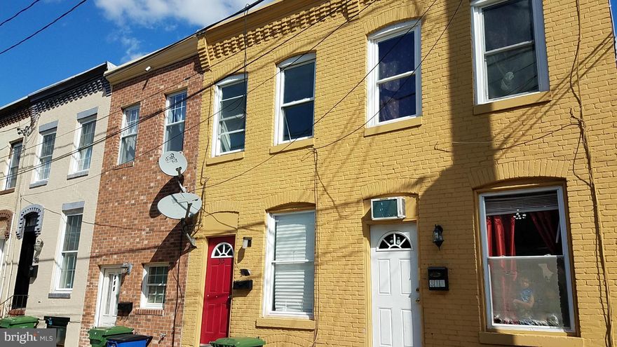 ANOTHER POTENTIAL REHAB OR PROSPECT TO ADD TO YOUR INVESTMENT PORTFOLIO IN HOT HIGHLANDTOWN! Tucked away from the busier streets and located in the budding arts & entertainment district, this side street has terrific potential. Surrounded by heavy rehab activity, short stroll to two art galleries, local well known pubs and a 2 minute walk to the quickly evolving Eastern Ave commercial district.