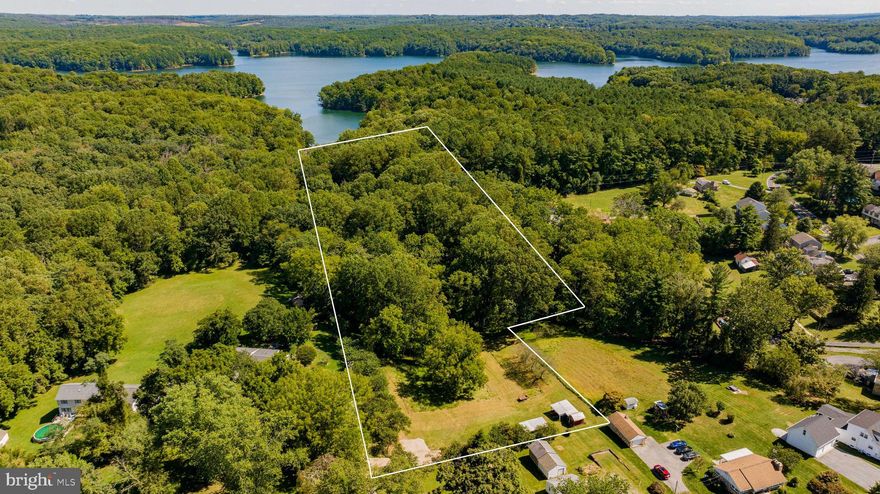 Nature lovers paradise! Create your own tranquil oasis backing  to Liberty reservoir property. Walk the trails, fish the lake, listen to the bird’s song. Public water available. 3 Br gravity septic preliminary plan attached.. Buyer to verify use with the county. One of a kind opportunity. This one won’t last! Schedule your appointment to see it today.