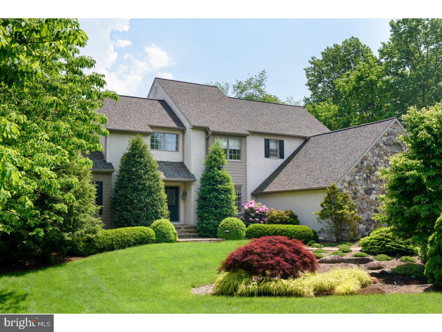 Nestled in the heart of Chester Springs, this Custom 4 Bedroom Cape Cod with First Floor Master Suite offers a scenic acre lot highlighted by stunning Gardens featuring a striking display of perennials, flowering trees and specimen plantings. As you step inside, you'll be greeted by the two-story Entry with hardwood floors that opens to the Dining Room accented by hardwood floors and decorative crown and chair moldings. Host large gatherings in the Kitchen, featuring an abundance of cabinetry, Jenn Air appliances-including gas cooktop, and a vaulted Breakfast Area with skylights and a wall of windows offering serene views of the backyard. Extend the entertaining into the adjoining vaulted Family Room with a dramatic floor-to-ceiling stone fireplace, skylights, and access to deck through triple sliding doors. The main level Master Suite is tucked away for privacy, while presenting a tray ceiling, walk-in closet with organizer and bath with vaulted ceiling, double bowl vanity and jetted tub. The finishing touches on the main level include a Library with custom built-in bookcases, Office with lovely backyard views, Powder Room, Laundry/Mud Room with outside access, and exit to the 3 car Garage. Upstairs you will find three nice-sized Bedrooms with ample closet space, a Hall Bath, and a partially finished 16x16 Storage Room. Paint and flooring is all that is needed to turn the storage room into a 5th Bedroom. You'll love the spacious, finished lower level with high ceilings, large utility sink (installed for washing dogs), windows, convenient exit to the rear yard and spacious storage room. Summer is approaching, so get ready for entertaining guests in the back yard of this wonderful property. The level yard is ideal for countless outside activities and provides potential for an inground pool. The expansive Deck is surrounded by professionally landscaped beds & fenced-in, manicured lawn that backs to open space. Updates include roof, kitchen skylights, Andersen sliding door in family room, exterior painting, some interior painting, front door, Kenetico water treatment system and hot water heater. A Spectacular Home in a quiet cul-de-sac neighborhood!