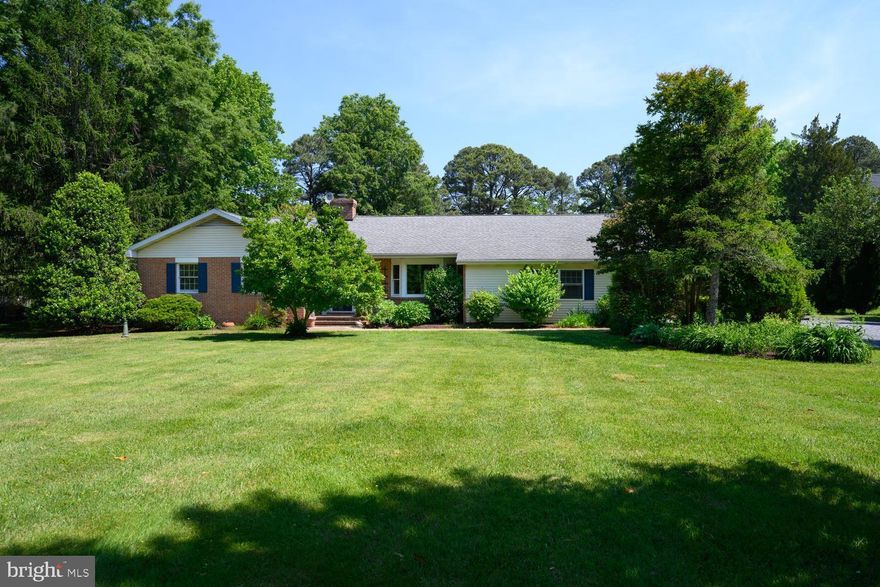 Harris Creek Waterfront. This 3 bedroom, 2 bath well maintained brick one story house is the perfect getaway. Nestled on 1.63+/- acres it is the perfect blend of privacy and community. This home features a large kitchen with several entertaining areas including a cozy living room complete with a fireplace and a large living room that overlooks the huge screen porch and Harris Creek and a gracious waterside paver patio.  The water frontage is spectacular complete with additional seating areas on the shoreline to enjoy the river and a dock with 4' MLW with a newer lift. The two car garage has an additional half bath and plenty of room for cars and additional storage. Carpet and paint have just been completed - this is a turnkey house just in time for the season.