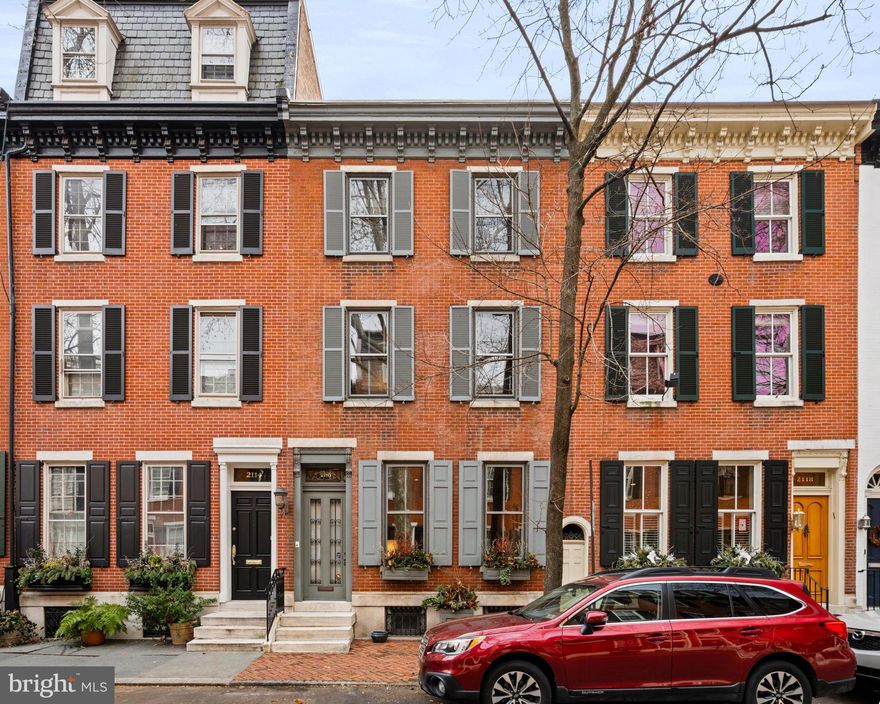 The charm of Fitler Square marries the sophisticated elegance of Rittenhouse Square at 2116 Delancey Place.  This 3 bedroom+ townhouse on quiet tree-lined Delancey features high ceilings, hardwood floors, and original details throughout. Enter through the vestibule into the gracious living room which features a fireplace, high ceilings, original plaster moldings, and an entry into the dining room.  Just past the dining room is a custom kitchen with beautifully milled cabinetry, and stainless appliances, and adjacent to a sunny breakfast room that looks out into the garden. The 2nd level of this home begins with an open family room/den with a decorative fireplace and beautiful built-in shelving. Additionally on this level are 2 bedrooms with a lovely hall bathroom recently renovated with marble tile, a single vanity sink, and a bathtub/show combo. The primary suite is on the 3rd level of this home and features built-in closets, an en-suite bathroom with a walk-in shower, and a single vanity sink.  Also on this level is a hall closet and additional room, currently being used as a home office but could also be used as a nursery or den. The lower level is a finished space and features a rec room with storage, laundry, and a powder room. This home has been impeccably maintained by the current owners and is conveniently located to nearby Fitler Square Park, the Schuylkill River parks, local coffee shops, restaurants, and retail, and a short commute to Penn, CHOP, Drexel, and 30th Station.  Located in the Greenfield Elementary School catchment.
