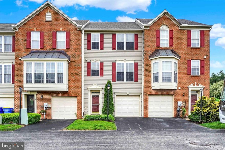 Welcome home to this great Condo! So spacious inside with extra rooms like a Family room on lower level and a gorgeous Sunroom right off the kitchen on the main level! Concerned about the roof and HVAC system? The HVAC system and the Water Heater were replaced  in 2021! The Roof was replaced in 2023! Many upgrades have been made, like Granite Counter Tops and an Island were added along with laminate flooring in the Sunroom and Living room,  Focal wall was added to the Family Room in the lower level. Some rooms are virtually staged. Deck boards were replaced in 2020! Hate being without electric? Generator Hookup in garage added in 2023! The range is gas but the electric outlet is there if you prefer electric. Pull down attic steps in the hallway of the 3rd floor were added to provide additional storage! Want to relax on your deck at night? Enjoy the privacy lattice, the lights on a timer and garden area for your flowers but no lawn to mow! This home is minutes to 83, grocery stores, shopping, coffee shops, fast food and restaurants. These condos do not come on the market often! Last time one was available was 2023 and it went under contract in 11 days! Schedule your showing quickly, this is a fantastic opportunity to purchase a great home!