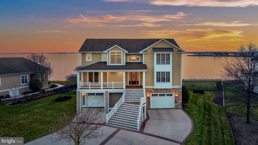 Rarely available, this stunning bayfront estate, designed by architect Greg Hastings and built by Garrison Custom Homes, with unobstructed open water vistas, is the ultimate paradise on quiet White Oak Road. With approximately 133ft of direct waterfront, experience panoramic views across the Rehoboth Bay, where an expanse of glass doors and large windows compliment the maximum use of indoor/outdoor space and natural light. Such an opportunity awaits you to live just a few homes from the Rehoboth Yacht and Country Club golf course, giving you both privacy yet access and all around exceptional views. With 5322 SF of above ground living space and an additional 1,243 SF of decks and patios, this house has room for all. The first level is devoted to recreation and total relaxation with a dedicated gym, recreation room, and hot tub all overlooking the outdoor paver patio on the water. In addition, one of two full laundry rooms, powder room and elevator greet you from the garage entrance, making this a practical element of living. On the main entertainment level, the waterfront open-concept floor plan blends a great room with fireplace, gourmet kitchen with walk-in pantry, dining room and sunroom-all with endless views. An expansive bayfront deck and screened porch are perfect for outdoor entertaining and sunsets over the water. Moving through this level, there is a guest bedroom with a private full bath, powder room for guests, and a private office with custom bookshelves. On the top level, there are 4 additional bedrooms with en-suite full bathrooms and a laundry room. The waterfront primary bedroom has a sitting room and is complete with an expansive private bath and dual closets. Each bedroom in the house boasts its own private, en-suite full bath. Multiple decks on each level to enjoy watching the boats and the sunset over the bay. The current owners updated and raised the bulkhead, added rip rap, and a new pier with a boat lift, 2 jet ski lifts and a kayak launch for watersports. This custom home includes a Generac generator, ample storage on each level, oversized garages, private fenced yard with dedicated well for irrigation, outdoor shower, and room for a pool. Country club membership is optional through an application process and not included in the sale. Showings to begin Friday 2/16.