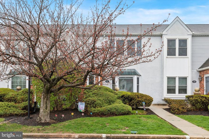 Beautifully Updated Townhouse in Prime Trooper Location - Trent Manor!  Welcome to this stylish and well-maintained larger 2-bedroom, 2.5-bath townhouse tucked in a highly desirable and conveniently located community just minutes from Route 422 off Trooper Road. With shopping, dining, and everyday conveniences like Home Depot, Walmart, and Wawa right around the corner, this home offers the perfect blend of comfort and convenience.  Step inside to find wood floors, recessed lighting, and an open, inviting layout. The kitchen features stainless steel appliances, gas cooking - rare for a condo. Both full bathrooms have been beautifully renovated with modern tile work, upgraded fixtures, solid surface counters, and even a Bluetooth speaker/light combo for a spa-like experience.  Upstairs, the spacious master suite includes a walk-in closet and private bath. The finished basement with a built-in bar is ideal for a man cave, game room, or cozy movie nights. Additional perks include basement laundry, a newer hot water heater (2023), several recently replaced windows (2024), and a brand-new composite deck overlooking a large, open and usable common area—perfect for outdoor enjoyment.  Enjoy low-maintenance living thanks to a Condo Association that covers trash, recycling, snow removal, landscaping, roof repairs, and exterior building maintenance including stucco.  With dedicated parking, a community that rarely sees turnover, and tons of recent upgrades, this move-in ready gem is a must-see!