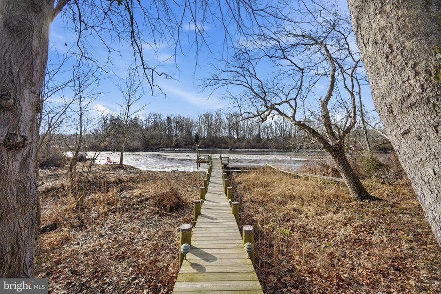 Experience true waterfront living on the beautiful Chester River in Millington, just 15 minutes from Middletown, DE. Situated on 0.53 acres, this charming riverfront carriage house captures breathtaking panoramic water views and offers the perfect blend of relaxation, recreation, and convenience.

An expansive lighted deck creates the ideal setting for morning coffee, outdoor dining, entertaining guests, or simply enjoying spectacular sunset views over the water.

Boating enthusiasts will love the private dock with a floating dock and multiple slips, providing direct access to the Chester River for boating, kayaking, fishing, swimming, and paddleboarding. The river truly becomes an extension of your backyard.

Inside, the light-filled two-bedroom layout offers comfortable and easy living, making it perfect as a primary residence, weekend getaway, or waterfront investment property.

Additional highlights include:
• New roof
• Public water and sewer
• No HOA – enjoy privacy and flexibility
• Quiet, scenic waterfront setting

Located just minutes from Middletown, Delaware, you'll have convenient access to shopping, restaurants, and medical facilities while still enjoying the tranquility of riverfront living.

This is a rare opportunity to own an inviting Chester River waterfront property where stunning views, boating access, and peaceful surroundings come together to create a truly special home.