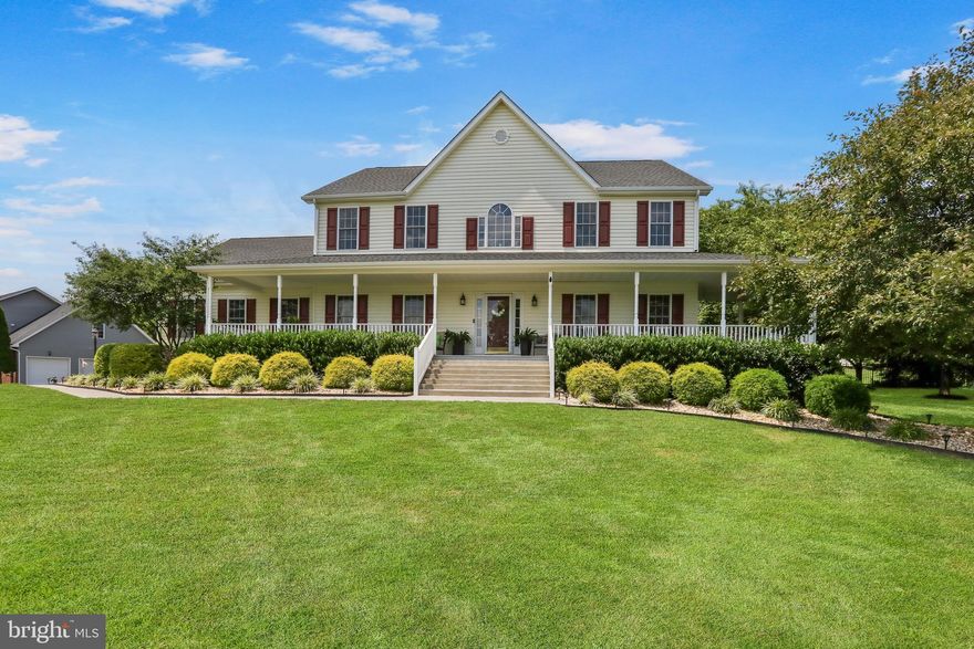 Welcome to this gorgeous Colonial in the established community of Eastland, set on a beautifully landscaped lot with an extended paved driveway, three-car side-load garage, and a large front porch that showcases gorgeous mountain views. Offering more than 4,700 square feet of finished living space across three thoughtfully designed levels, this home balances timeless elegance with modern comfort.

The main level invites you in with a grand foyer that opens to sun-drenched formal living and dining rooms—perfect for hosting elegant dinners or gathering with friends. At the heart of the home, the gourmet kitchen blends beauty and function with a generous breakfast area that flows seamlessly into the family room. Here, a cozy fireplace creates the perfect backdrop for quiet evenings at home, while wide windows frame peaceful views of the property.

Upstairs, the primary suite offers a true sanctuary with a spacious sitting room ideal for unwinding at the end of the day. The spa-inspired bath features a soaking tub, separate shower, and dual vanities, while the expansive walk-in closet ensures abundant storage. A junior suite with its own walk-in closet and private bath provides comfort and privacy, and two additional bedrooms are connected by a Jack and Jill bath, making this level both gracious and functional.

The finished lower level extends the home’s versatility and charm with its own private entrance. A full bedroom and bath, second washer and dryer hookup, and kitchenette with wet bar and refrigerator make it the perfect setting for long-term guests, multi-generational living, or a welcoming in-law or au pair suite. The expansive recreation room is ideal for entertaining, casual living, or creating the ultimate home retreat.

Step outside to discover an outdoor living space as inviting as the interior. A spacious backyard offers a deck and paver patio, perfect for al fresco dining, summer celebrations, or quiet mornings with coffee in hand. A storage shed adds convenience, while the mountain backdrop creates a picture-perfect setting for daily life.

The Eastland community provides a welcoming neighborhood feel while placing you close to everyday conveniences. Schools, shopping, and dining are just minutes away, with abundant recreational opportunities nearby including parks, golf courses, and the Shenandoah River. Commuters will appreciate easy access to Routes 7 and 340, as well as proximity to Route 50 and I-81. The property is also convenient to Winchester Regional Airport and within reach of Dulles International Airport, making travel simple. With its gorgeous views, elegant interiors, and versatile living spaces, this home offers an extraordinary lifestyle in a truly remarkable setting.