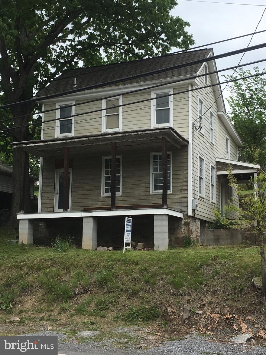 Built in 1870 this property is a contributing  building to the historical designation for the town of Berkeley Springs.  It is not on the historical register, so those rules do not apply to any  renovations to this house.The current owners began the restorations about 15 years ago.  New roof 10 years ago, all new windows, new plumbing and electrical has been installed, working bath on the upper floor and a sink, fridge and cooktop in the kitchen make this a possible weekend project. Hardy plank has been installed on most of the outside (enough material to finish the rear and left side), original wood siding on the front of the house.Bring your imagination to this house and finish it to bring back to the look of days gone by.  The large back yard has space for gardening