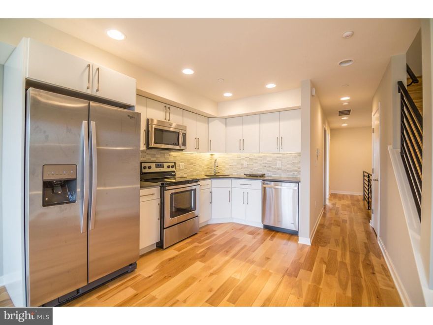 Nestled in the heart of the growth and expansion of Point Breeze is 2046 Federal Street, a brand new construction condo building. Unit 3 comes with not one, but TWO separate outdoor spaces, including a massive roof deck with outstanding skyline views! Enter into the 3rd floor unit to find your first bedroom, full bathroom with stall shower, kitchen, and living room. Thanks to the huge sliding glass doors leading to the balcony off of the living room, there is no shortage of natural light while lounging on your couch. The kitchen is equipped with dark quartz counter tops, tall white cabinets, and stainless steel energy efficient Whirlpool appliances. The second floor of this multi-level unit has the laundry area and two additional bedrooms, both with their own en suite bathrooms. Up one more flight of stairs is your magnificent roof deck! Separated into 3 units, 2046 Federal features a brick exterior with security systems in each unit, and gorgeous hardwood floors throughout. The monthly condo fees are still TBD but will cover all common areas, water, and insurance. There is a tax abatement on the property and the builder will provide a 1 year builder's warranty.