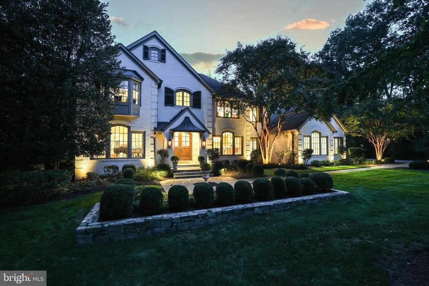 Discover unparalleled luxury and exquisite craftsmanship in this extraordinary home! Meticulously designed and re-constructed by a collaboration of skilled architects, designers, and passionate owners, every aspect of this residence reflects timeless elegance located in the top-rated Langley School District.

Approach through a captivating walkway with reclaimed European cobblestone, setting the stage for a truly enchanting entrance. As you near, the warm glow of gas lanterns flanking the arched mahogany front doors, fitted with Rocky Mountain hardware, welcomes you to a world where timeless elegance meets modern luxury. Enter the grand yet inviting foyer, featuring a hand turned, curved staircase illuminated by the Mansard Tole Lantern flanked by formal living and dining rooms.

The chef's dream kitchen with a wealth of natural light boasts a Wolf dual fuel range, Miele appliances, Pennville cabinets, spacious marble island, and more. The adjacent Hearth Room features a stone fireplace and built-in cabinetry with hidden workstations. The family room, adorned with a large stone fireplace, opens to a screened porch. The mudroom, accessible from the 3-car sideload garage, features custom lockers, a family powder room, and a room with a pet shower.

The Owner’s Retreat is a true oasis, complete with a sitting area, Juliette balcony, built-in cabinetry with a hidden desk, and a seamless entry to the primary bath. Custom his and her closets offer thoughtful features, and the primary bath is a masterpiece with dual sinks, ample storage, a two-place shower, Waterworks bathtub, Perrin and Rowe hardware, a dressing table, and heated flooring.

Additional bedrooms on this level are all en-suite with high-end baths, custom closets, and special features. A laundry room and family staircase complete this level. The lower level features a professional-grade gym, a guest suite with a private bath, a spacious family room with a stone fireplace and access to the Outdoor Living Room. A spa-like bath, locker area, steam shower, second laundry room and a surprise stage room with stage lights and a green room add to the allure.

This resort-like backyard offers an unparalleled retreat, creating an atmosphere of relaxation and entertainment for an idyllic lifestyle complete with living room with a gourmet kitchen, saltwater pool, 10-person spa, stone fire pit, and lush landscaping.

Control 4 home automation and whole home sound distribution, lawn irrigation, copper gutters, wide architectural molding, six-inch rift and quartered oak floors, and four wood-burning fireplaces enhance this property. Conveniently located near shopping, dining, and commuter routes, this cul-de-sac based Reston neighborhood with no through streets offers the epitome of luxury living. Schedule your visit now and unlock the door to your dream home!