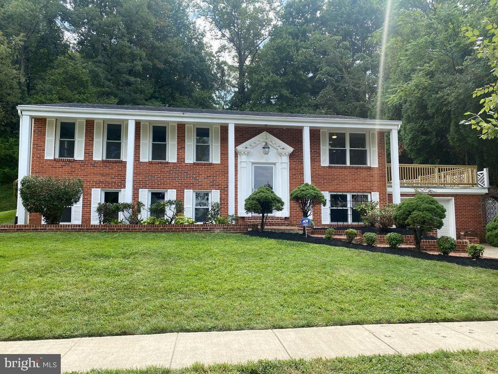 BACK ON MKT. AS BUYER COULD NOT PERFORM. SELLER JUST APPROVED A PRICE REDUCTION AS HE WANTS IT SOLD ASAP!!! Beautiful renovated detached brick front split foyer in sought out quiet neighborhood with lots of curb appeal. Sun filled home features 4 bedrooms & 3 full baths with recent updates on a .25 ac large lot. Features include gleaming hardwood floors, new ceramic tile, new WTW carpeting in basement, new gourmet kitchen w/ SS appliances, soft close cabinets and granite countertop, crown & dentil molding, recessed lights, freshly painted, programmable thermostat, open floor plan, attached oversized garage w/concrete driveway for 4 cars, ceiling fans throughout, new roof, CAC, new full size washer & dryer, nice landscaping and much more! Basements area contains lots of storage space, bonus room that can be used as an office/den/bedroom and large open rec room area for different entertainment activities. Exterior home features include a large brick rear patio for those summer BBQ's and space overtop of the garage for lounging. GREAT LOCATION and conveniently located to shopping, restaurants, Top Golf, MGM Casino, Tanger Outlet, major transportation routes and more. Please reach out to the LA with any questions. Reduced and priced to sell! All seller Disclousre forms are already downloaded into Bright MLS.