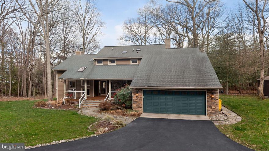 Located in Greenhill Manor along 300 feet of shoreline on Goose Cove, where the quiet waters feed into Main Creek and ultimately the Bodkin River, this exceptional four-acre waterfront  property offers something increasingly rare in today's market — genuine privacy, abundant natural beauty, and a lifestyle that unfolds at its own unhurried pace. With trees framing both sides of the yard leading to the water’s edge, the setting feels like a private nature sanctuary.  With a clear easterly view of the cove, the pier and the 8,000 boat lift, you have a constant and inviting reminder of the waterfront life just steps away.  Deer wander through, osprey circle overhead, geese honk and on any given morning, a fishing line cast from your pier is all the agenda you need.
Step back toward the house and the outdoor living spaces are impressive. A generous Trex-style deck runs the width of the home and serves as the central hub of exterior life.  Extended out from the deck is a firepit and nestled under a pergola is a new hot tub with a cover.  Whether you're soaking under the stars on a cool fall evening or starting a summer morning with coffee, this space delivers. Nearby, the three season screened porch is perfect for enjoying those freshly caught and cooked crabs.  The outdoor amenities continue with a dedicated covered grilling area, a substantial shed with a workbench and an additional shed for yard equipment. 
Inside, the home's five bedrooms are arranged across two levels, with two bedrooms conveniently located on the main floor and three additional bedrooms upstairs. The main level is anchored by light hardwood floors that run throughout, creating a warm and cohesive flow from room to room.  An expansive island with a wet bar and quartz counters is the focal point of the updated kitchen along with stainless steel appliances, built-ins and cabinetry finishes that feel current without feeling cold.   
The primary suite offers access to the sunny upper deck and a serene view of the water.  Additionally, there is a bonus room attached currently configured as a home office, though its flexibility makes it equally suited as a nursery, reading room, creative studio, or private sitting space offering that extra square footage that always proves more valuable than anticipated.
Throughout the home, the abundance of natural light gives every room a lifted, welcoming quality. Combined with the privacy of the four-acre lot, the mature tree canopy, and the gentle soundtrack of Goose Cove, this is a property that doesn't just check boxes. It changes the way you live and reminds you exactly why you chose it.  Greenhill Manor is located within the Cedarwood Cove community which has a voluntary homeowners association offering a swimming pool, swim team and park pavilion upon payment of an annual fee.  
________________________________________