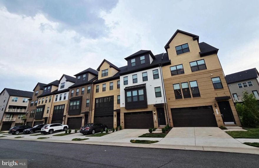 Experience elevated living in this like-new, barely lived-in corner-unit townhome nestled in The Boulevards at Westfields. This sought-after Bennington II model by K. Hovnanian offers 5 spacious bedrooms and 4.5 beautifully appointed bathrooms, thoughtfully designed for both style and functionality.
Perfectly positioned on a premium corner lot, the home is bathed in natural light thanks to additional windows that create a bright, airy ambiance throughout. The heart of the home is a sophisticated gourmet kitchen, featuring high-end appliances, sleek finishes, and a generous center island—ideal for entertaining or casual everyday living. Just off the kitchen, a versatile main-level office or sitting area provides the perfect space for working from home or relaxing.
A sun-drenched sunroom offers a peaceful retreat for morning coffee or unwinding at the end of the day. Step outside to an impressive two-level deck, creating exceptional space for outdoor entertaining and enjoying scenic views.
The top-level loft adds incredible flexibility, featuring a private bedroom, full bathroom, and a comfortable sitting area—ideal for guests, an au pair suite, or multi-generational living.
The corner location enhances both privacy and outdoor living potential, making this home a truly rare and desirable opportunity in a highly sought-after community.