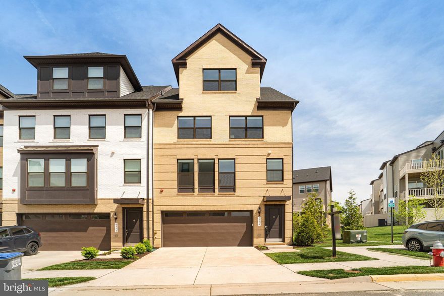 Experience elevated living in this like-new, barely lived-in corner-unit townhome nestled in The Boulevards at Westfields. This sought-after Bennington II model by K. Hovnanian offers 5 spacious bedrooms and 4.5 beautifully appointed bathrooms, thoughtfully designed for both style and functionality.
Perfectly positioned on a premium corner lot, the home is bathed in natural light thanks to additional windows that create a bright, airy ambiance throughout. The heart of the home is a sophisticated gourmet kitchen, featuring high-end appliances, sleek finishes, and a generous center island—ideal for entertaining or casual everyday living. Just off the kitchen, a versatile main-level office or sitting area provides the perfect space for working from home or relaxing.
A sun-drenched sunroom offers a peaceful retreat for morning coffee or unwinding at the end of the day. Step outside to an impressive two-level deck, creating exceptional space for outdoor entertaining and enjoying scenic views.
The top-level loft adds incredible flexibility, featuring a private bedroom, full bathroom, and a comfortable sitting area—ideal for guests, an au pair suite, or multi-generational living.
The corner location enhances both privacy and outdoor living potential, making this home a truly rare and desirable opportunity in a highly sought-after community.