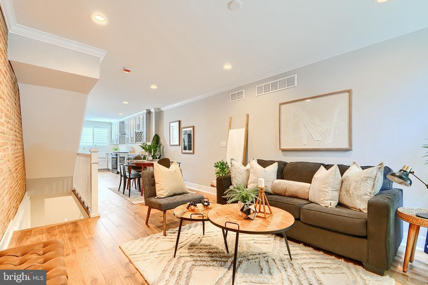 Welcome to this beautifully reimagined Canton residence, where historic charm meets modern luxury. Grants, Credits & Builder Warranty are available for this Home.  Step inside and discover spacious interiors adorned with rich hardwood floors and thoughtful finishes throughout.
The open-concept main level features a bright living area with a reversed staircase that flows seamlessly into the dining space and a showstopping gourmet kitchen. Designed for both style and functionality, the kitchen boasts brand-new stainless steel appliances, a wine fridge, an under-counter microwave, granite countertops, and under-cabinet lighting—perfect for everyday living or entertaining. Just beyond, a private rear patio offers the ideal space for grilling or relaxing outdoors.
Upstairs, two spacious bedrooms share a stylish full bath and a convenient upper-level laundry. The private third-level primary suite is a true retreat, featuring a luxurious en suite bath, custom closets, and a landing area with a dry bar. Step outside to a cozy balcony that leads to a rooftop deck with sweeping city and water views—perfect for entertaining or sunset lounging.
The fully finished lower level adds impressive versatility with 8-foot ceilings, a spacious bonus den, a full bath, and a fourth bedroom ideal for guests or a home office.
All of this in the heart of Canton—just moments from the waterfront, parks, and vibrant city life. Don’t miss your chance to own this one-of-a-kind home that blends modern comfort with timeless character. While it doesn't have a CHAP Tax Credit, there are other credits and grants available, along with a 1-year builder warranty. Schedule your private tour today!