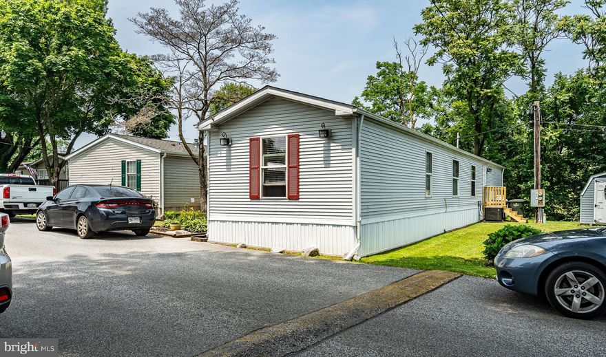Welcome to the most affordable home in Chester County, nestled Hidden Valley Estates in beautiful East Fallowfield! This well-maintained and updated mobile home offers comfortable living in a peaceful community. Step inside to discover a thoughtfully updated interior, featuring 3 bedrooms and 2 bathrooms, and a surprisingly large living space. As you enter the home, you'll be welcomed by a spacious living room that seamlessly flows into the inviting kitchen. The updated kitchen showcases modern appliances, sleek countertops, and ample cabinetry, providing a stylish and functional culinary space. One side of the home accommodates a convenient laundry room and a large primary suite complete with a full bathroom. On the opposite side of the home, you'll find two additional bedrooms and a full bathroom, providing comfortable living spaces for all. The bathrooms have been tastefully updated, offering a contemporary ambiance. Additionally, the newer HVAC system ensures optimal comfort and energy efficiency year-round. The mobile home boasts a newer front porch, enhancing the curb appeal while providing a cozy spot to enjoy the outdoors. Whether it's morning coffee or evening conversations, this space invites you to unwind and connect with the community. Hidden Valley Estates offers a welcoming neighborhood atmosphere. Enjoy the convenience of nearby amenities, shopping centers, dining options, and easy access to major highways for commuting. Take advantage of this unique opportunity to own the most affordable home in Chester County! Don't miss out—schedule a private viewing today and secure your spot in this coveted community.