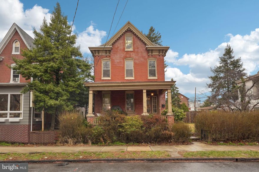 Victorian charm in the heart of Pottstown! This beautifully maintained 1890s home blends historic architecture with modern updates. Enter from the spacious front porch overlooking a quaint street. The home's original craftsmanship is showcased with classic features such as pocket doors, ten-foot ceilings, and ornate woodwork. Take note of the large room sizes with great square footage in the living and dining rooms. The kitchen was tastefully updated in the last few years with newer appliances (range 2020, dishwasher 2023, fridge 2024) - perfect for a busy household. This spacious three-story home offers four bedrooms on the second floor, with a primary bedroom that has a private balcony overlooking the backyard.  There is also a spacious fifth bedroom on the third floor, including a newly refinished bathroom—ideal for a guest suite. Recent updates include refinished original hardwood floors on the main level, laminate flooring upstairs, and a new mini-split unit for cooling on the main level. Ample storage is available in the full basement area. This home is also located on an oversized lot twice the size of most properties in the area. Enjoy the outdoors with premium fenced side and rear yards. It also features a 2-car detached garage with additional storage above. Conveniently located near parks, local dining, coffee shops, breweries, and a seasonal farmers market. Easy access to Route 422 and Route 100.  Value still exists in this crazy market! Schedule your showing today.