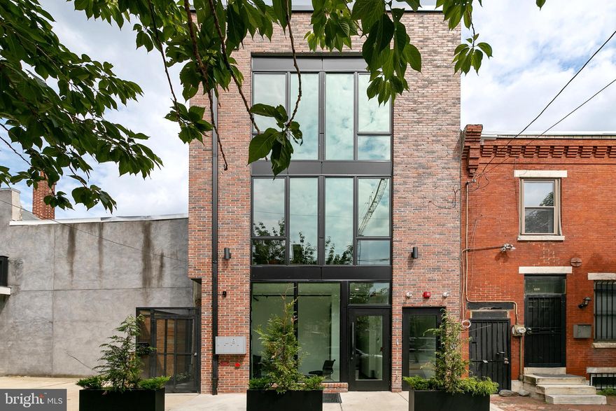 Welcome to Lawrence St. This modern, spacious bi-level units hosts 2 beds, 1.5 bath and features private patio, w/d in unit, and central air in a great Northern Liberties location. Follow your private entrance to the main living space which features 10 + foot ceilings, eat-in kitchen with shaker cabinetry and contemporary quartz countertops, convenient half bath, and large floor-to-ceiling windows that flood the space with natural light. The living room leads to private garden space, offering an indoor-outdoor flow which is perfect for entertaining. Downstairs you will find two generously sized bedrooms with large closets, a full bath with ample storage, and convenient full sized washer/dryer. A polished concrete floor, stylish/classic tile choices, and custom Pella windows complete the modern vibe. No details were overlooked in this building! Building is outfitted with fire alarm system, sprinklers, intercom and camera system to ensure safety and security. conveniently located near I-95. Walking distance to great bars and restaurants including: Yards Brewing, Cafe La Maude, North Third, and even Target.