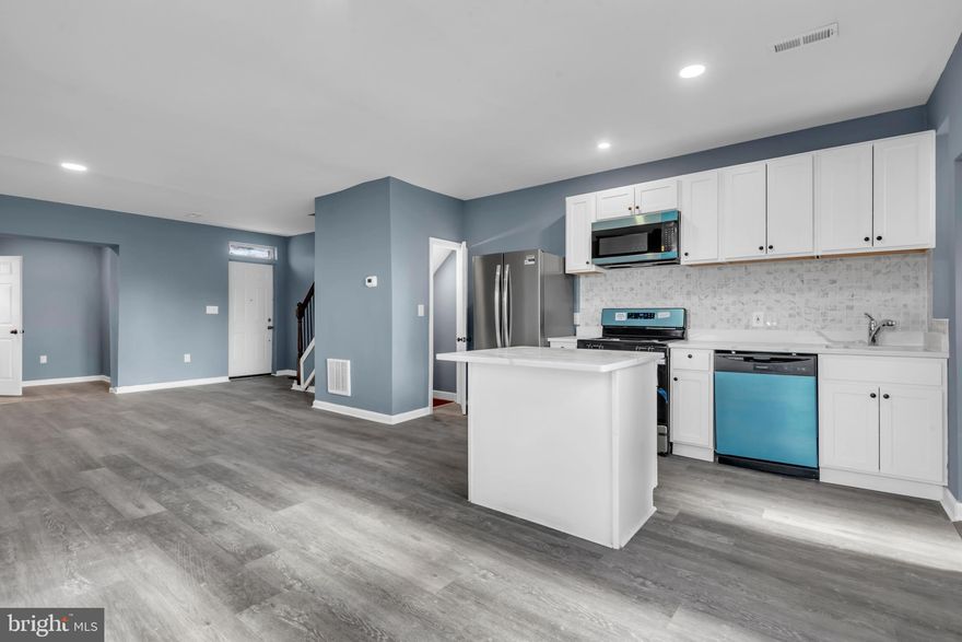 Stunning fully renovated 3BR/1.5BA home loaded with upgrades and natural light. This modern, move-in ready home features an open-concept layout with oversized windows that flood the space with sunlight, luxury vinyl flooring throughout, and elegant hardwood stairs.

The show stopping kitchen is equipped with quartz countertops, stainless steel appliances, a sleek backsplash, and a center island, perfect for entertaining and everyday living. Enjoy added convenience with a main-level powder room and mudroom, plus a partially finished basement offering additional flexible space.

Major updates include ALL NEW systems which include the HVAC, central A/C, water heater, electrical panel, and windows giving you peace of mind for years to come.

This is the one you’ve been waiting for, modern finishes, major upgrades, and incredible value. Schedule your showing today before it’s gone.