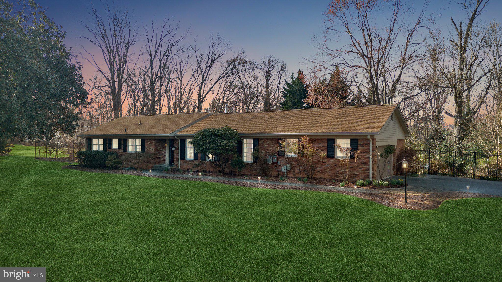 Nestled on a private 1.72 acre lot, this timeless four-bedroom, three-and-one-half-bath ranch home boasts a welcoming almost 4,500 square feet of living space that is brimming with natural light from oversized windows. From the garden, to the private porches off the rear and the swimming pool, this property truly has a backyard oasis that envelops you in a world of privacy and tranquility, surrounded by mature trees and lush greenery of Goshen Estates.
Immediately when entering the foyer, you are met with an open floor plan, adorned with hardwood floors and crown moldings that showcase the home's exquisite craftsmanship. The kitchen is truly a chef's dream, complete with stainless steel appliances, a six burner cook top, an oversized pantry, plenty of cabinet space, all topped with an oversized window with views of the luscious backyard. Off the kitchen you will also find easy access to the two and a half-car garage. Beyond the kitchen lies a great room perfect for entertaining guests, also with access to the backyard. The great room's soaring ceilings flood the room with natural light. A dining room and formal sitting room are perfect for having friends and family over for dinner or hosting for the holidays.
At the other side of the home there are four generously sized bedrooms, including the owner's suite with an en suite full bath and a large walk-in closet with custom built-ins. An additional hall full bathroom, laundry closet, and powder room complete this level.
The massive lower level provides even more entertainment options, including a spacious recreation room, a den, billiards room, and so much additional storage.
The backyard is truly something you have to see for yourself! The swimming pool was just relined 4 years ago, and makes for a great time over the summer. There are endless opportunities for entertainment and space for hammocks, firepits and more! A gracious storage shed is set towards the back of the lot for your outside storage needs.
Pride of ownership is evident in the maintenance and improvements throughout the home. The home features updated heating and cooling systems, newer roof, owned solar panels, stainless appliances, refreshed paint and decor. Known as a hidden treasure of a neighborhood, Goshen Estates was developed specifically to cultivate idyllic homesites while being conveniently located close to major transportation routes, including I-270, I-495, and the Metro. 8536 Plum Creek Drive offers a serene retreat that is still within easy reach of the hustle and bustle of city life.