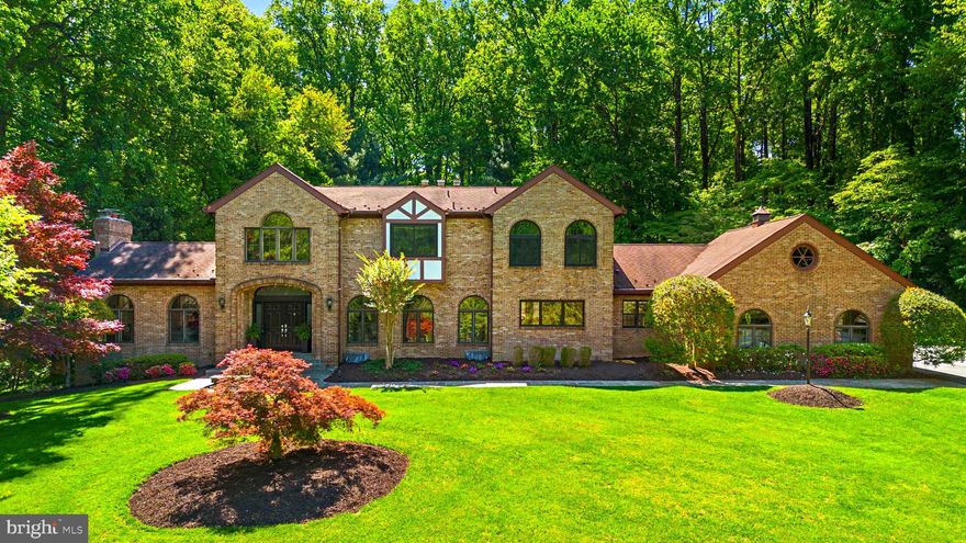 Nestled in the serene enclave of Bryants Grove this exquisite manor-style residence offers a luxurious lifestyle on a sprawling 3.06-acre lot. The exterior, crafted from elegant brick, exudes timeless charm, while the lush landscaping and mature trees create a private, secluded retreat. Step inside to discover a meticulously designed interior that seamlessly blends comfort and sophistication. The gourmet kitchen, featuring upgraded countertops and a spacious island, is a culinary enthusiast's dream. Enjoy meals in the inviting breakfast area or entertain in the grand dining space adorned with crown moldings and chair railings. The home boasts five generously sized bedrooms and five and a half bathrooms, including a lavish primary suite with an opulent bath. Rich hardwood complemented by a stunning curved staircase and built-ins that enhance the home's character,  the main level is an entertaining delight.Cozy up by one of the four fireplaces, each with elegant glass doors and mantels, creating a warm ambiance for gatherings. The finished walkout basement offers additional living space with a large bedroom ,fireplace, wet bar,and a private side exit. This would lend itself to inter generational living! Outside, a personal pool invites relaxation, and a charming gazebo provides a perfect spot for outdoor entertaining. With scenic vistas of the garden and woods, this property is a true sanctuary, offering an exclusive lifestyle that balances luxury with the tranquility of nature. Experience the perfect blend of elegance and comfort in this remarkable home.This home is a true delight and has been upgraded to provide a 21st century experience.close to shopping ,public transportation, and major roadways yet feels like a country retreat. Bryants Nursery is a rural rustic road which helps to preserve the natural environment and wildlife abounds..