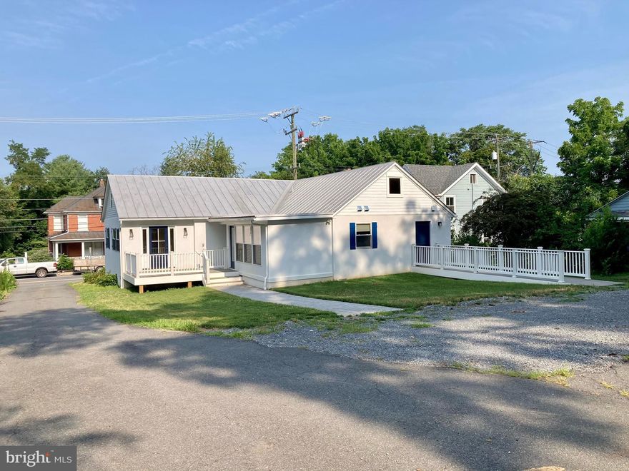 Beautifully renovated office building with gorgeous finishes in the heart of Western Loudoun's historic & cultural area.  Close to the town's shops and services, and W&OD trail.  Plenty of parking for a small practice with welcoming entry in rear.   Attractive reception and waiting area.   4 private rooms each with  built-in countertops with sinks and one with  a mini fridge. One with private entrance/exit.  Consult room with sliding door.  Large office or breakroom with kitchenette (refrigerator & dishwasher) and 2nd bathroom.  Newly refinished hardwood floors throughout. Roughed-in basement space also included with exterior access only;  ideal for storage.   Great potential for use as a dental office, vet clinic, medical office, law office,  spa or salon.  Handicap accessible. Tenant responsible for all utilities. Also available for sale.