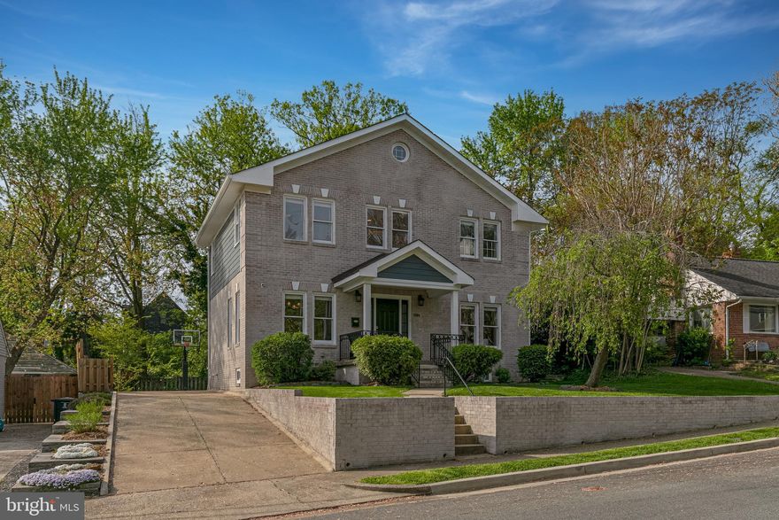 Modern Elegance Meets Timeless Charm in the Heart of North Arlington
Welcome to 5204 20th Street N, where luxury, location, and lifestyle converge. Conveniently located in the midst of one of Arlington’s most coveted neighborhoods, this beautifully expanded and updated home has been well-maintained and continually improved over the years.  It delivers a rare blend of refined living and everyday comfort in an unbeatable location. 
With 5 bedrooms, 3.5 baths, an extra large 2-car attached garage, and over 4,000 square feet (including garage) this home is exactly what you’ve been looking for.
Curb appeal stuns with brick exterior and matching retaining wall, lovely flowering weeping cherry tree, a wide driveway with a welcoming front porch. Step inside to sun-drenched living spaces, gleaming hardwood floors, and a smartly designed layout that balances open-concept flow perfect for entertaining!
The heart of the home is a true gourmet kitchen featuring stainless steel appliances, a hammered copper farmhouse sink & touchless faucet, oversized quartz island, and custom cabinetry. A major main-level renovation was completed in 2020, bringing a fresh, modern feel to the heart of the home. In addition to the kitchen redesign, this renovation also added a modern gas fireplace and feature wall, refinished wood floors, custom Craftsman-style interior railings, new Hardie siding, PVC window trim, and maintenance-free composite decks.  In 2023, for the most recent touch in the exterior renovation, the brick and retaining wall were professionally limewashed—a rare upgrade that strengthens and protects brick.
Adjacent to the kitchen, the family room—complete with a cozy gas fireplace—opens seamlessly to the professionally manicured backyard, where a flagstone patio and an in-ground basketball hoop invite you to relax, dine, or play. The home backs directly to Big Walnut Park, creating a private oasis for morning coffee, al fresco dinners, or impromptu soccer games just beyond your gate.  Perfect for those snow days, Big Walnut is a hidden gem for sledding and winter fun as well!
Upstairs, the spacious primary suite offers a serene retreat with a spa-inspired en-suite bath and a generous walk-in closet. Three additional bedrooms, 2nd level laundry room, and a beautifully renovated hall bath (2023) round out the upper level—giving you plenty of space for family, guests, or a home office setup.
The finished lower level adds serious flexibility with a large rec room, full bath, kitchenette/bar area, guest bedroom and bathroom, with walk-out private entrance—perfect for a home gym, video gaming room, in-law suite, or weekend guests.
Ideally located just minutes from Virginia Hospital Center, Westover Village, Lee-Harrison Shopping Center, Ballston Quarter, top-rated schools, and major commuter routes, this home offers peace, privacy, and convenience—with exclusive backyard access to Big Walnut Park as the cherry on top.
5204 20th St. N isn’t just a home—it’s a lifestyle upgrade.