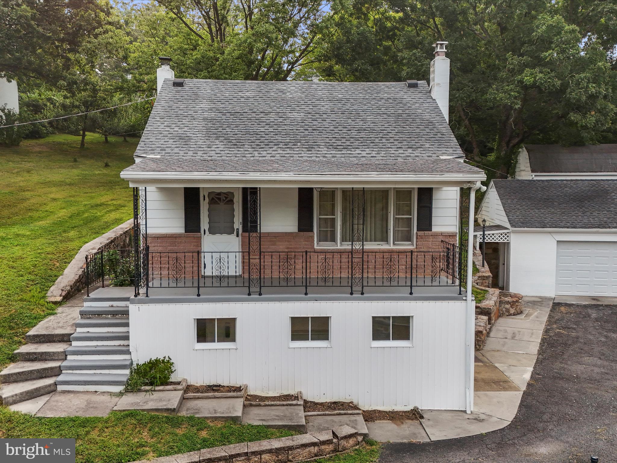 41 Franklin Street, Berkeley Springs, WV 25411
3 Bedrooms | 2 Bathrooms | Detached 2-Car Garage | $259,900
Full of character and well-maintained over the years, this multi-level home offers space, flexibility, and strong bones—ready for your personal touch. With three bedrooms, two full baths, and a detached two-car garage, it’s an excellent opportunity for buyers who value function, charm, and future potential.
Interior highlights include hardwood flooring, tile, and carpet, with a combination of forced air via heat pump, electric baseboard heat, and a wood stove for supplemental warmth. The upper level includes two bedrooms, one with built-in shelving and attic access—perfect for storage or creative use.
The lower level adds even more versatility with a cozy family room, a freshly painted concrete floor, and a secondary kitchenette with a refrigerator, stove, and porcelain double-bowl sink—great for canning, entertaining, or extra prep space. A second full bath, laundry area, and multiple storage rooms—one with exterior access—round out the space.
Outside, the 24'x26' detached garage offers three garage door openers and additional storage space above—ideal for tools, equipment, or weekend projects.
A unique in-town property with a layout that works for today and potential for tomorrow—just minutes from downtown Berkeley Springs.