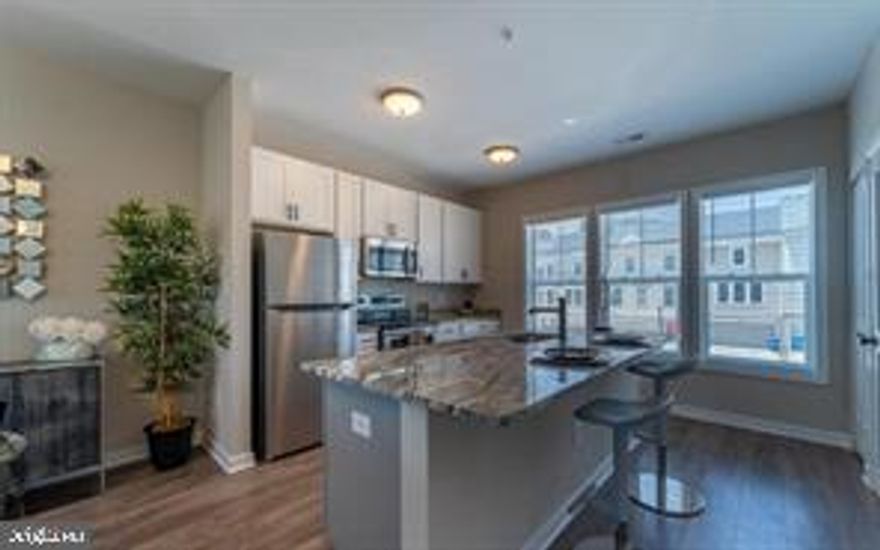 Starting in the upper 300s, only 3 stunning new construction condo townhomes left in the heart of Congress Heights! These 2 & 3 bedroom, 2.5 & 3.5 bathroom home features a modern open-concept living space with hardwood floors, sleek kitchens w/stainless steel appliances and granite countertops, plus in-unit laundry and dedicated parking make this an ideal urban retreat. Experience the convenience of living near shopping, dining, and transportation options in a vibrant community. The neighborhood is only blocks from numerous schools, adding to the appeal and desirability of this lively community. The neighborhood is surrounded with beautiful parks and recreational facilities, providing a perfect setting for outdoor enthusiasts to enjoy. Take advantage of nearby green spaces for picnics, sports, or leisurely strolls. Additionally, there are various recreational centers catering to diverse interests, such as fitness classes, sports leagues, and community events, fostering a close-knit and active neighborhood atmosphere. This property qualifies for the HPAP down payment assistance program as well as other Programs in DC. Please note that these photos are of the model home, which illustrate the finishes of each unit, but not the exact floorplan.