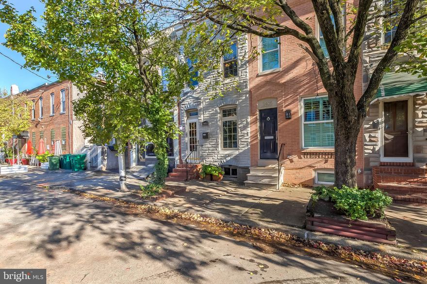 Welcoming you, is 1403 Decatur Street in charming Locust Point, Baltimore. Renovated in 2012 and just blocks from the water! This two bedroom, one and a half bath rowhome invites you with the bright charm that Locust Point has to offer. Enjoy the exposed brick walls, unique historic trim, stainless steel appliances, beautiful bathrooms, and a light filled kitchen with breakfast bar. The back yard greets you with access to the rooftop deck which features a beautiful view of Baltimore's famous Inner Harbor and surrounding city skyline. A few blocks from historic Fort McHenry, LaTrobe Park, and McHenry row, you will find ample parking with easy access to Baltimore's interstate highways.  Welcome Home.