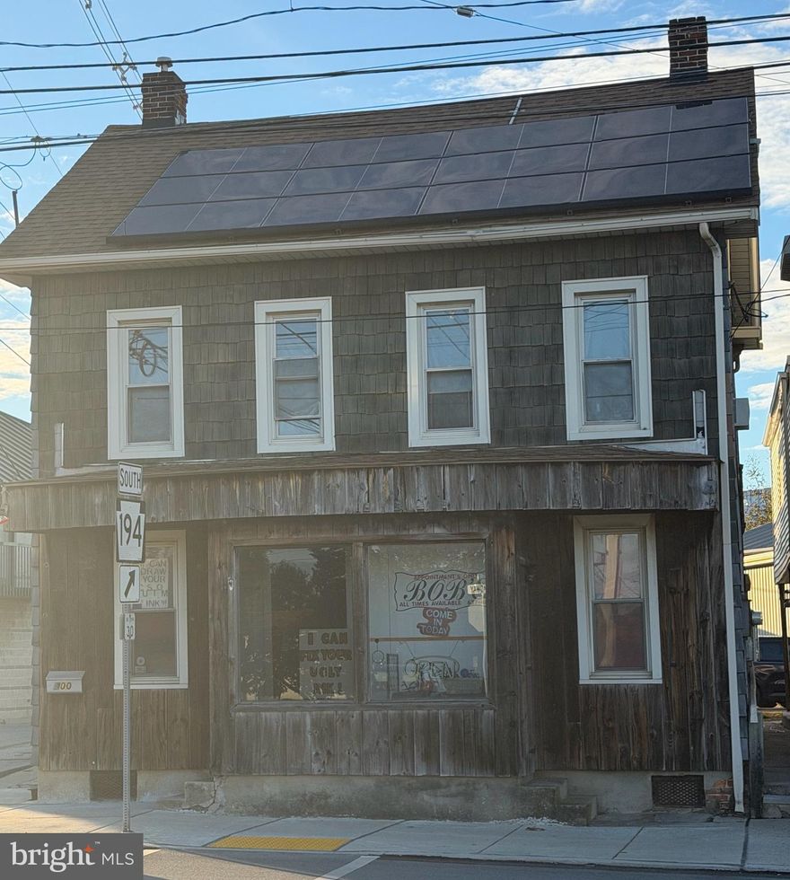 Great opportunity for a live in business owner. Currently being used as a tattoo parlor or convert it back as a living space & rent out the 2nd & 3rd floors. House is a 3 bedroom unit.