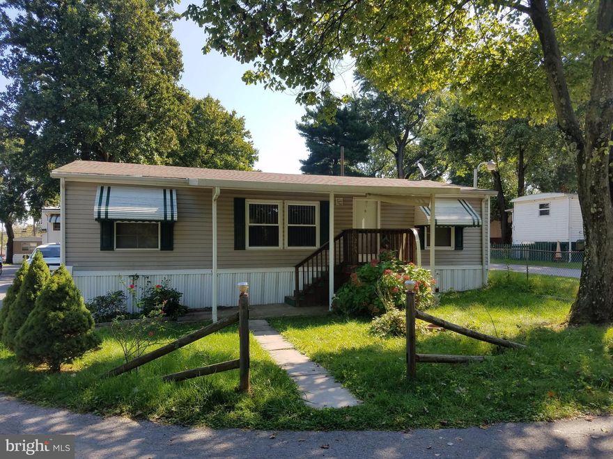 Big price reduction!  In great condition, this 2004 will not disappoint.  Step in tub in master suite with walk-in closet.  Nice appliances, Whirlpool washer and dryer. Low lot rent.  Fenced rear yard.  Hard to believe this is a mobile home. Three bedrooms on a quite street in a desirable spot, facing wooded area.  Ample parking and nice yard too! As is sale.