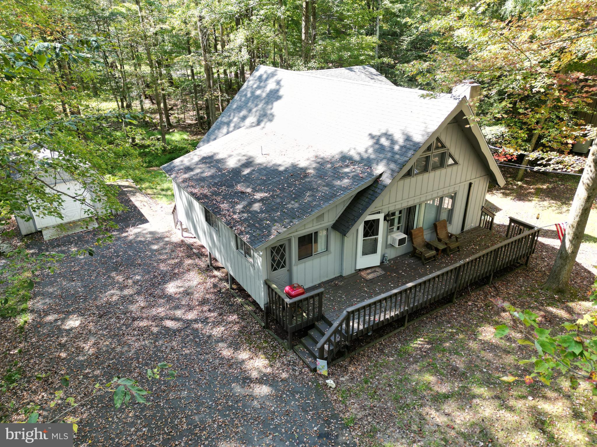 Looking for a turnkey vacation home? Look no further! Stunning 3 bed 2.5 bath chalet in the Locust lake Village community. Everything is included! The open floor plan gives the home a cozy yet spacious feeling. Enjoy the beautiful fall foliage on the front deck. Located on a private wooded lot with circular driveway. Commuter location! Close to all major Pocono attractions!