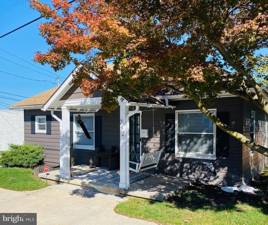 Charming home with a delightful front porch , small private rear yard with a new wooden fence,  nice landscaping, and a detached one car garage. This quaint house has maintenance free vinyl plank floors throughout, classic white kitchen with soft close drawers and doors, microwave, dishwasher, and gas stove.